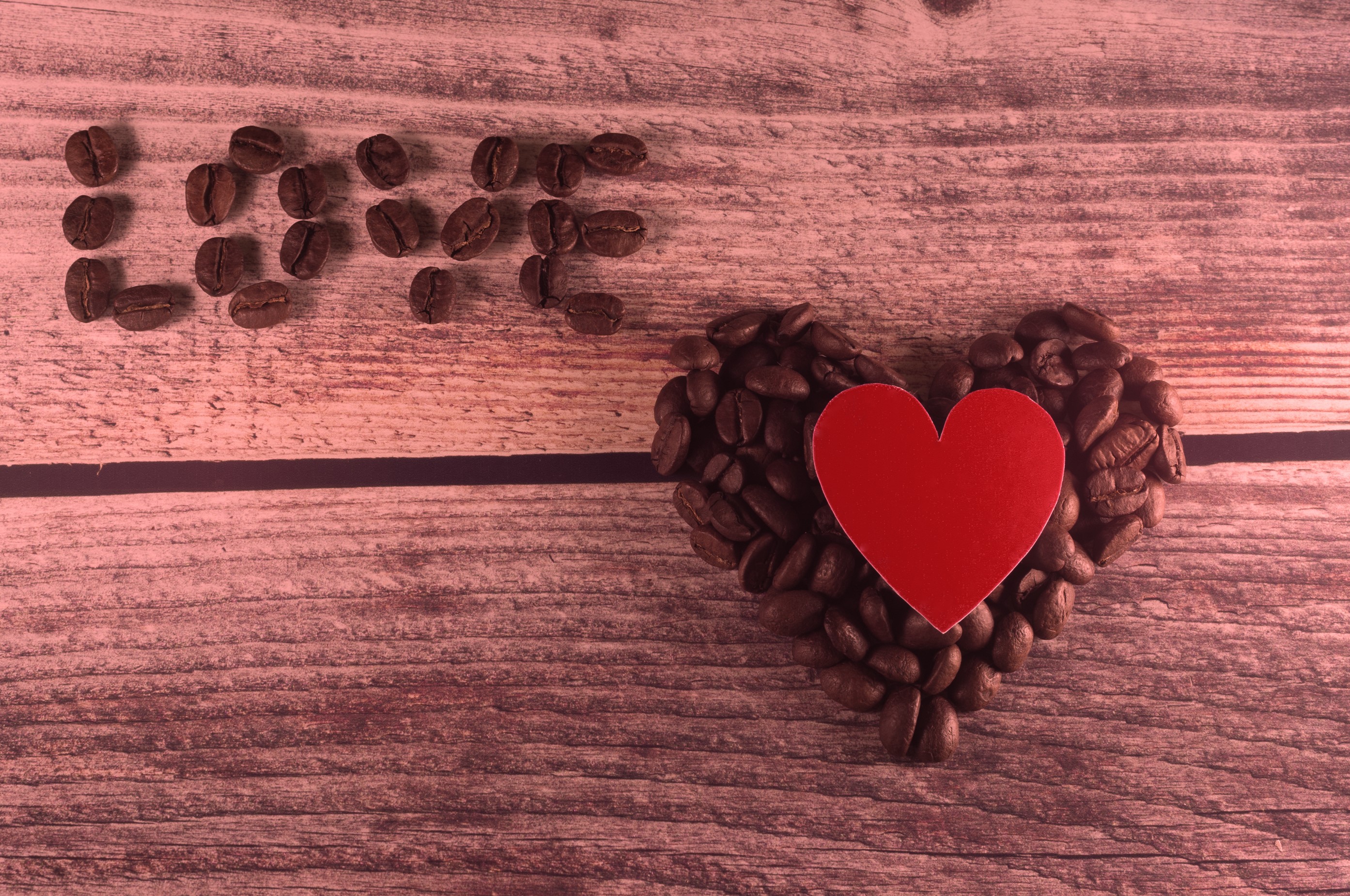 Coffee beans spelling LOVE next to a heart shape HD Wallpaper