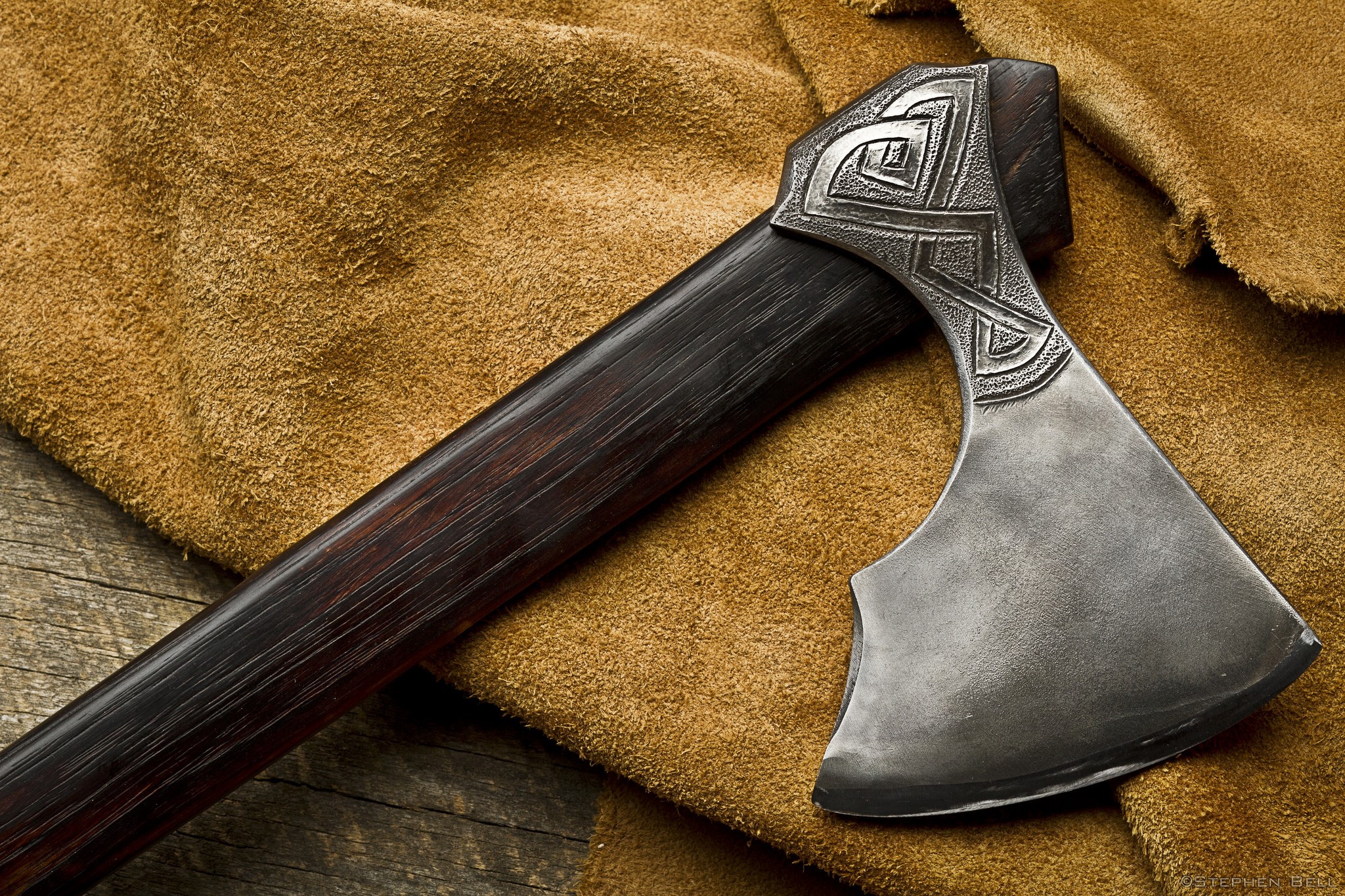 Close-up of a Viking battle axe with ornate metalwork HD Wallpaper