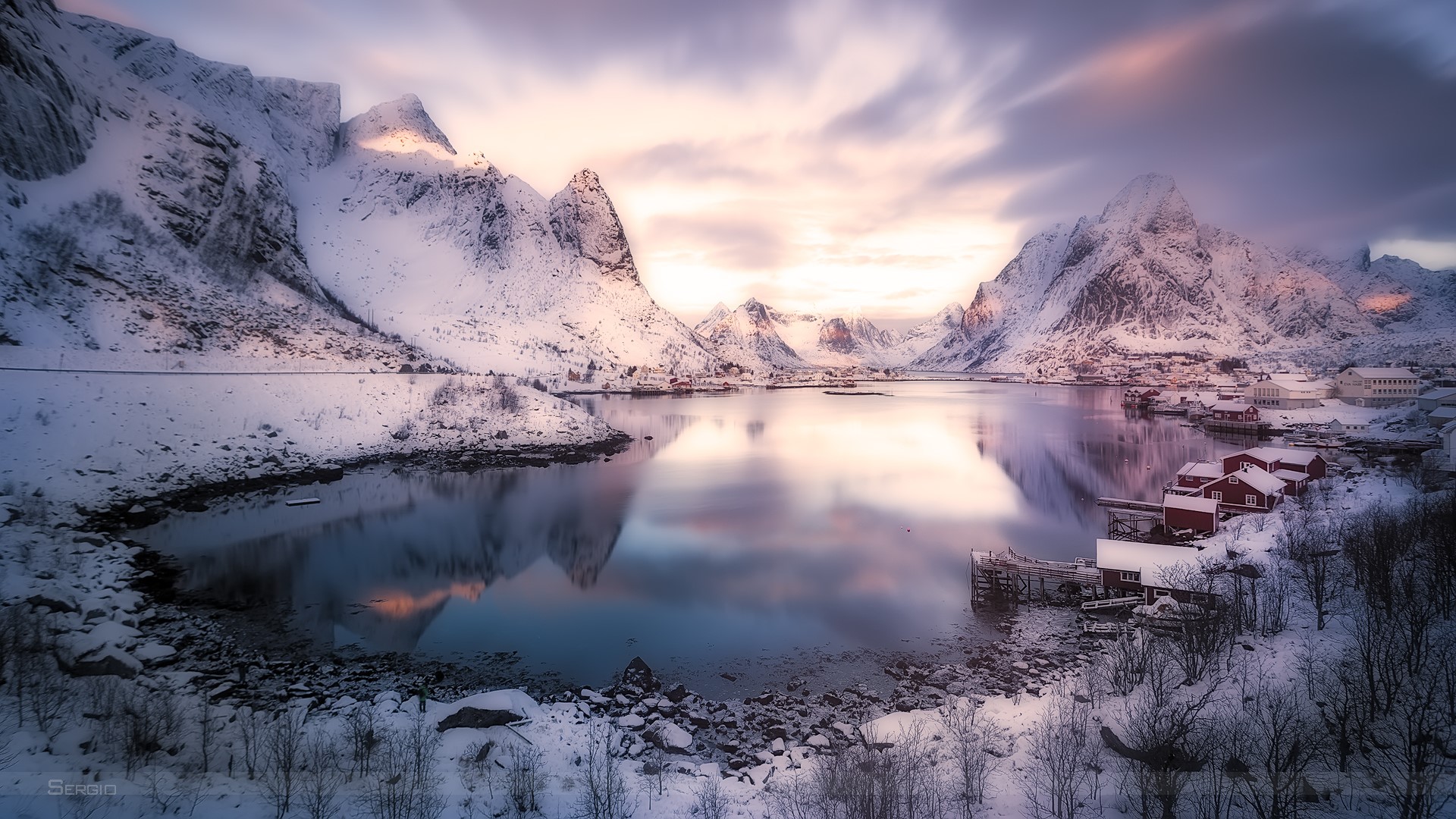 Snowy mountains and lake with red houses HD Wallpaper