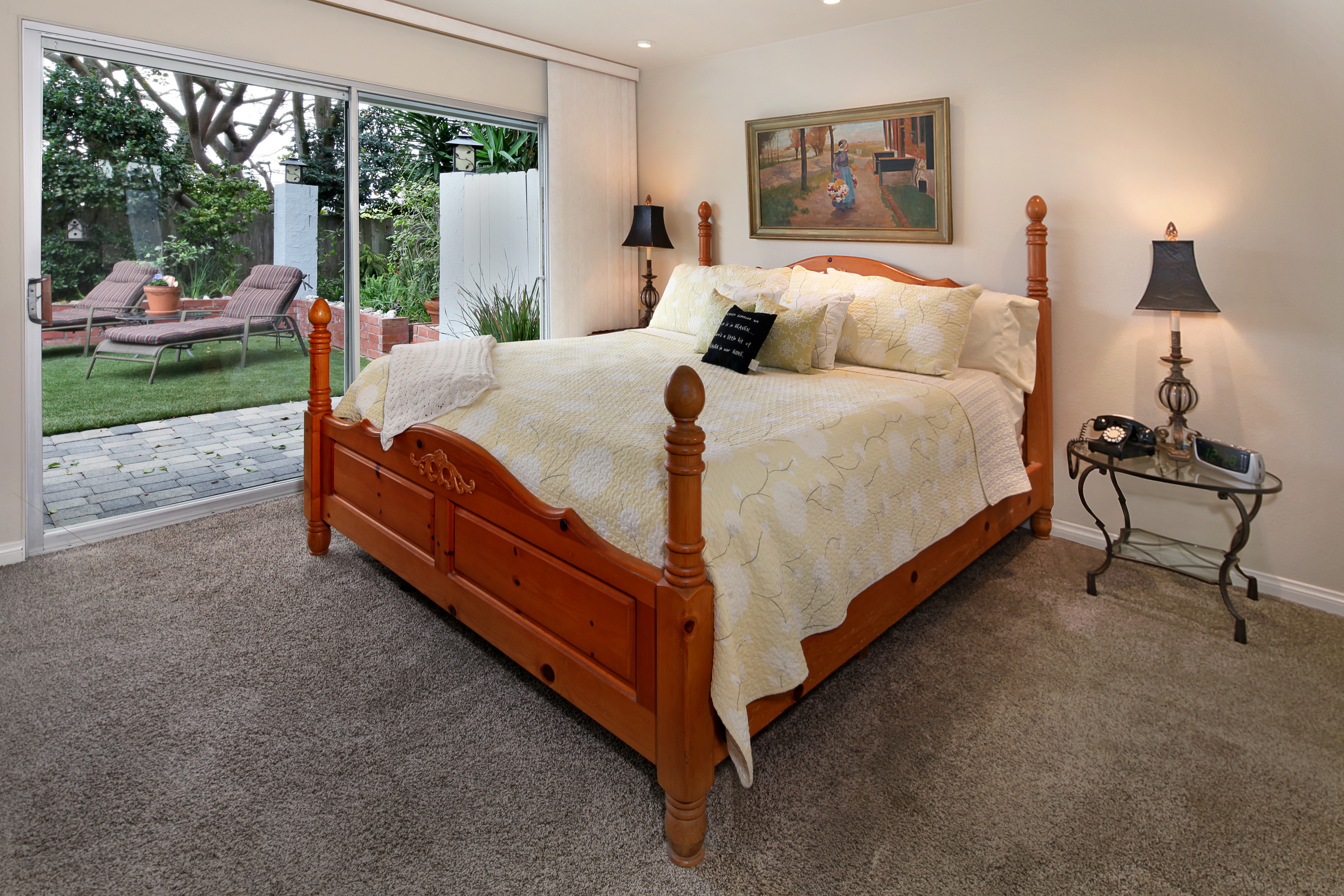Bedroom with sliding glass door to backyard HD Wallpaper