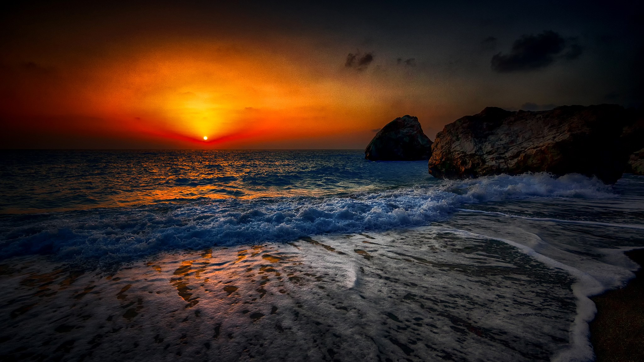 Sunset over the sea with waves and rocks HD Wallpaper