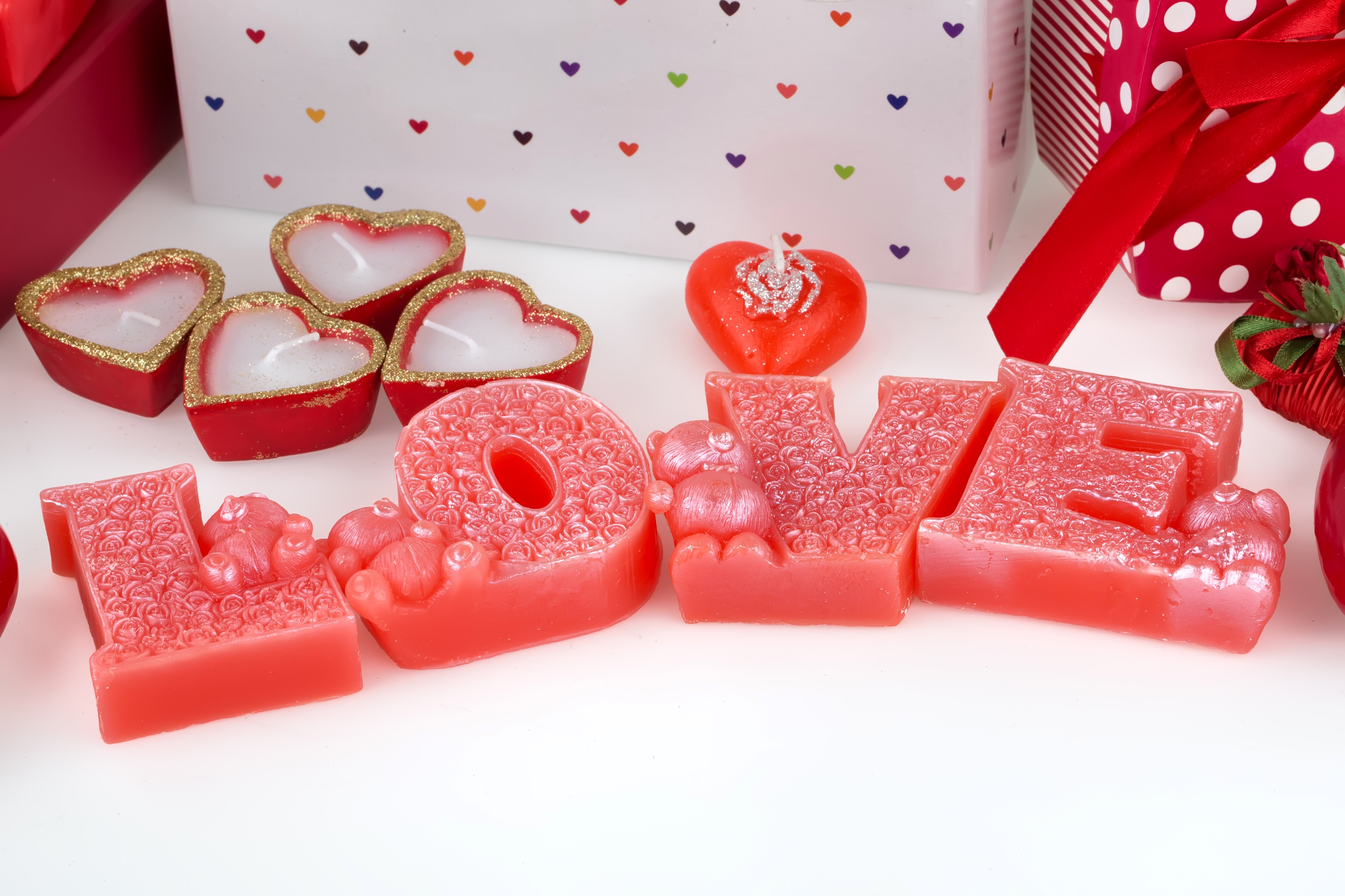 Valentine's Day candles in the shape of hearts and the word LOVE HD Wallpaper