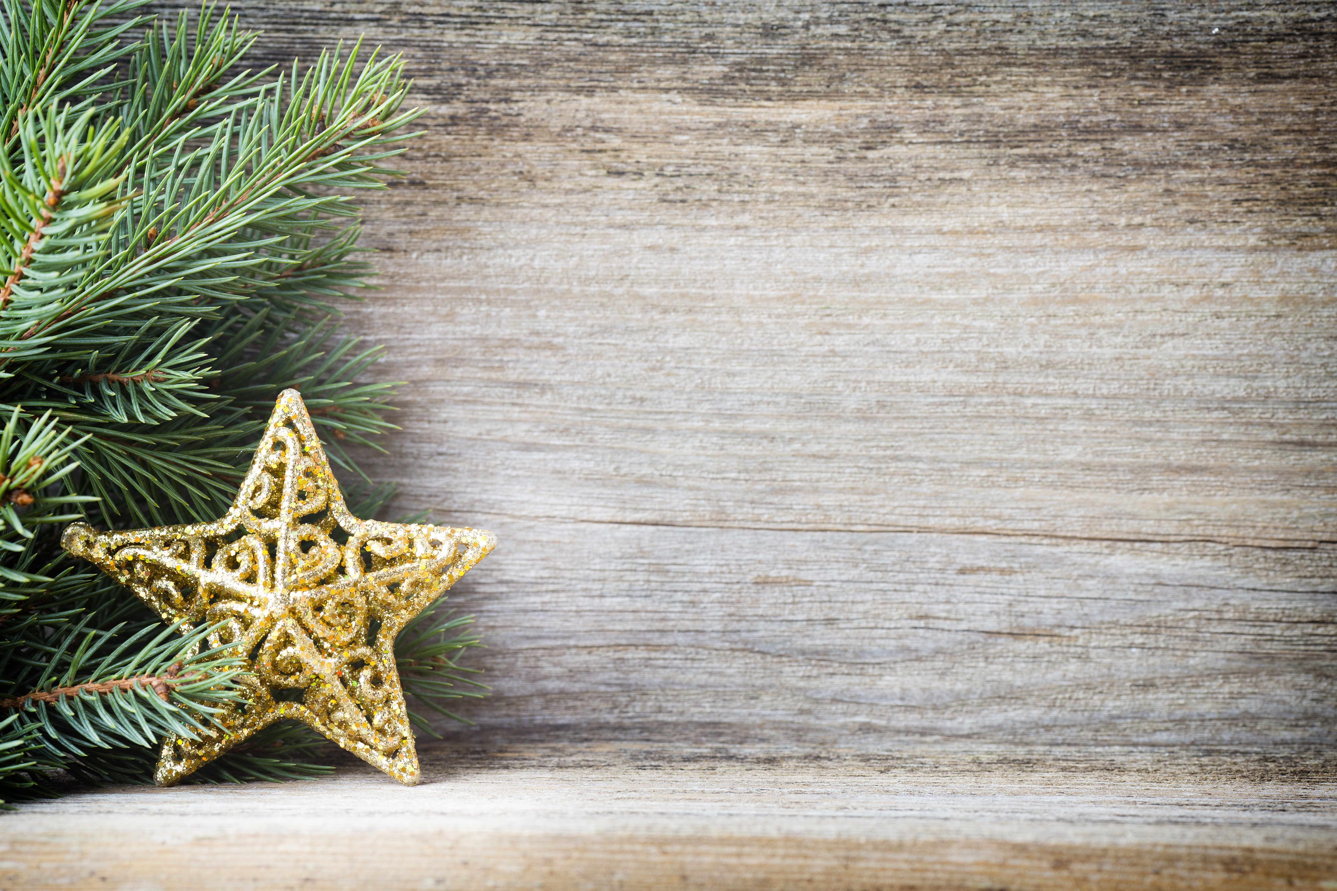 Christmas Fir Branches and Golden Star on Wood HD Wallpaper
