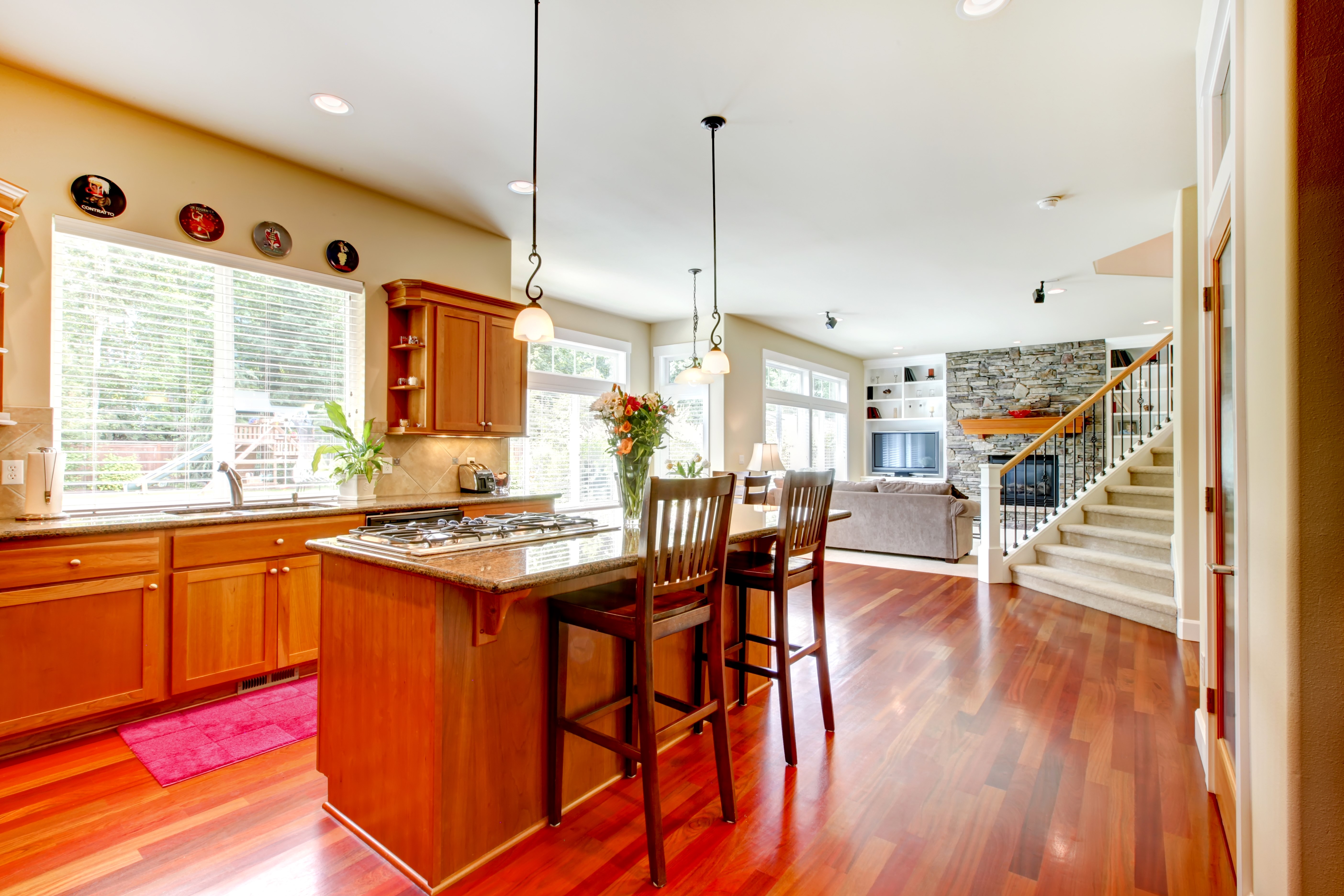 Kitchen island with chairs and open-plan living area HD Wallpaper