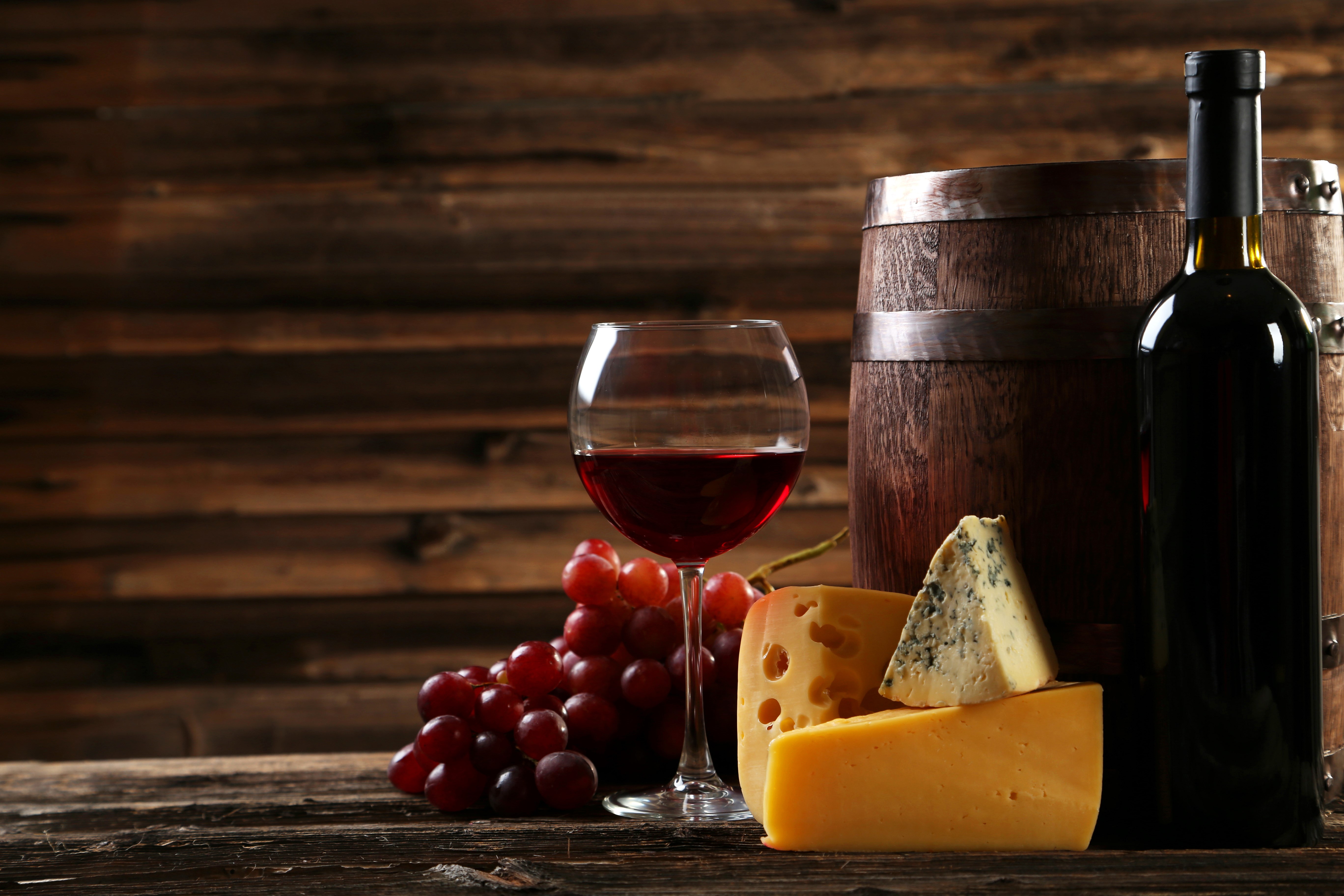 Wine bottle, glass, grapes, cheese, and barrel HD Wallpaper