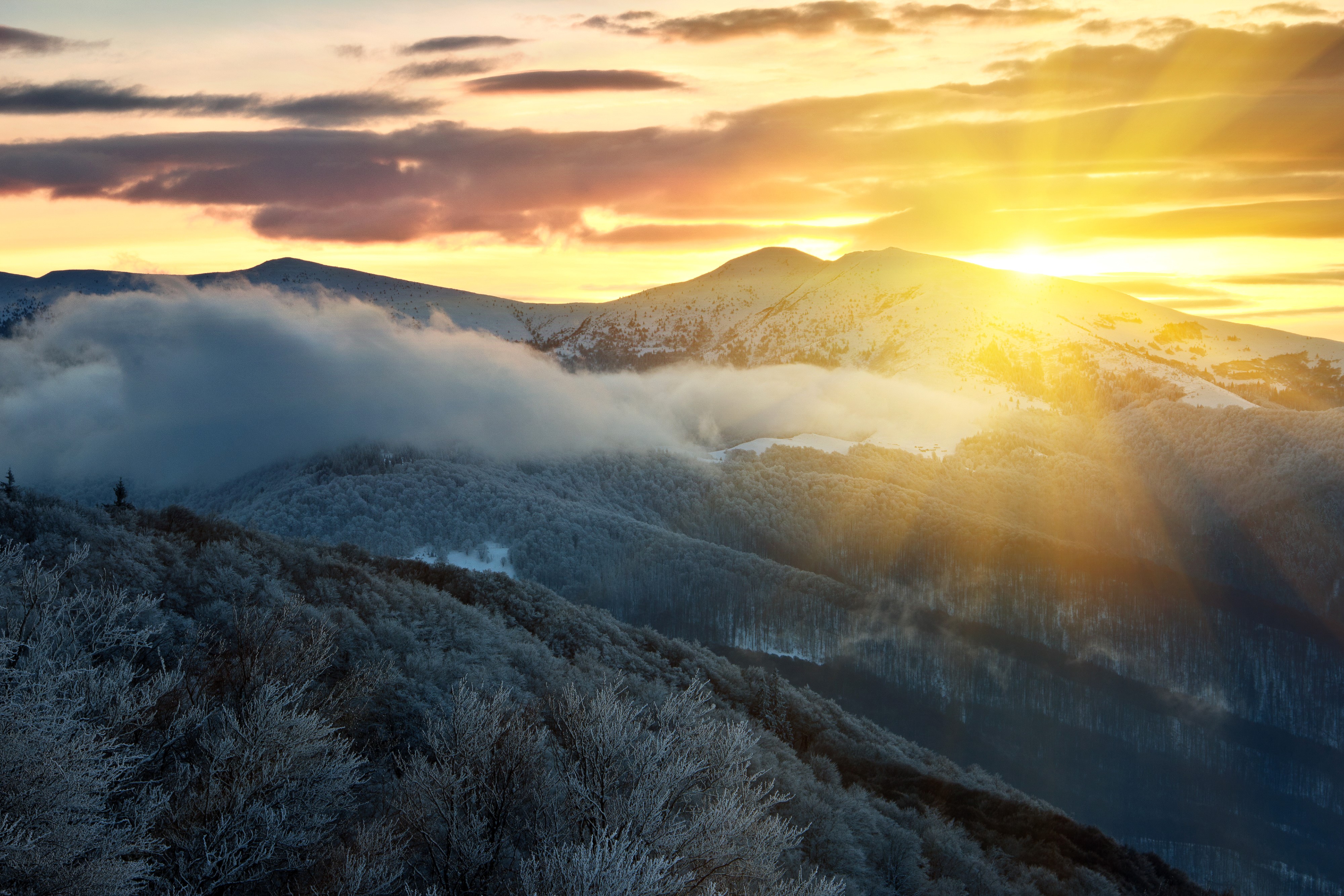 Sunrise over snow-covered mountains with clouds HD Wallpaper
