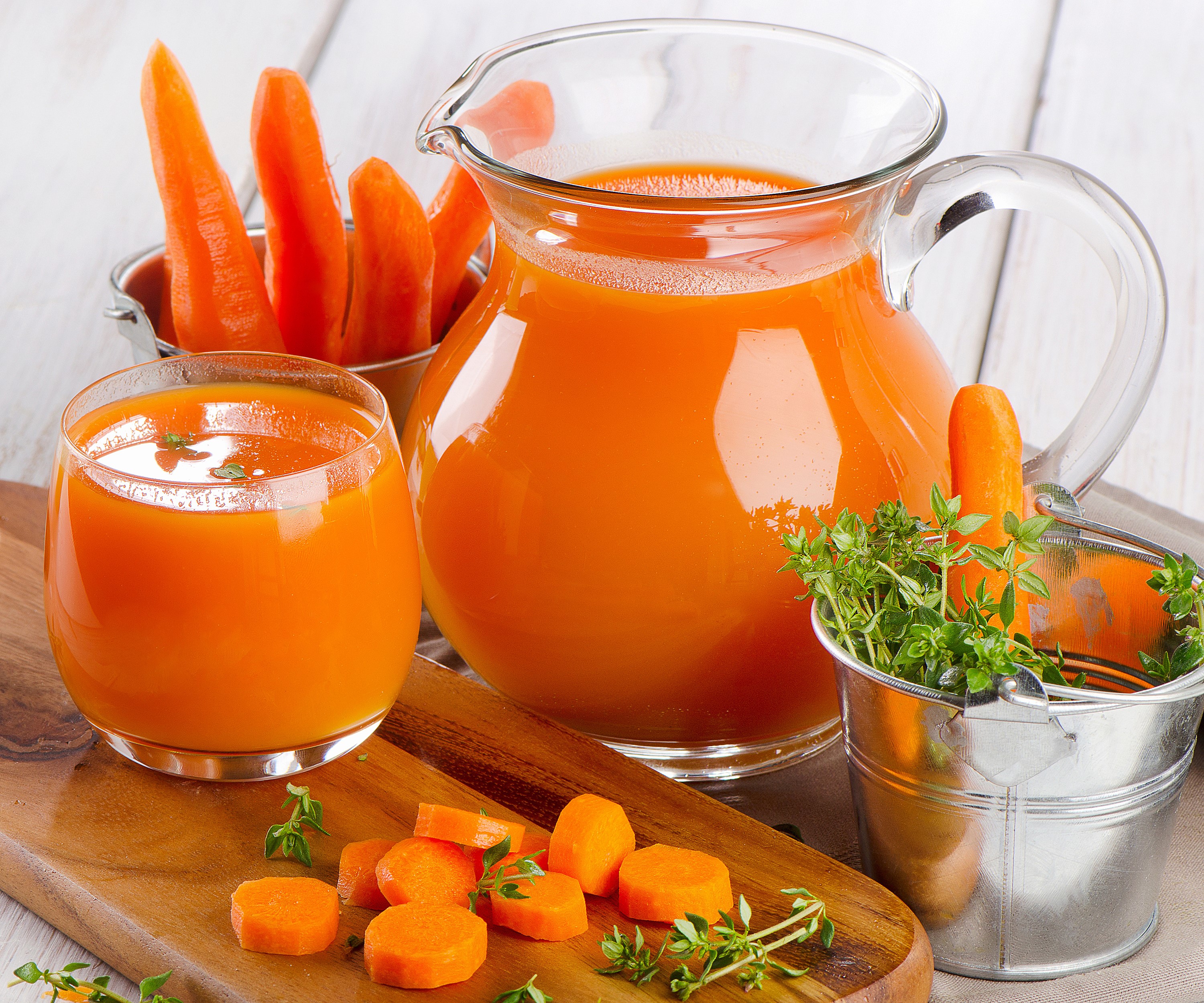 Carrot juice in a pitcher and glass with fresh carrots HD Wallpaper