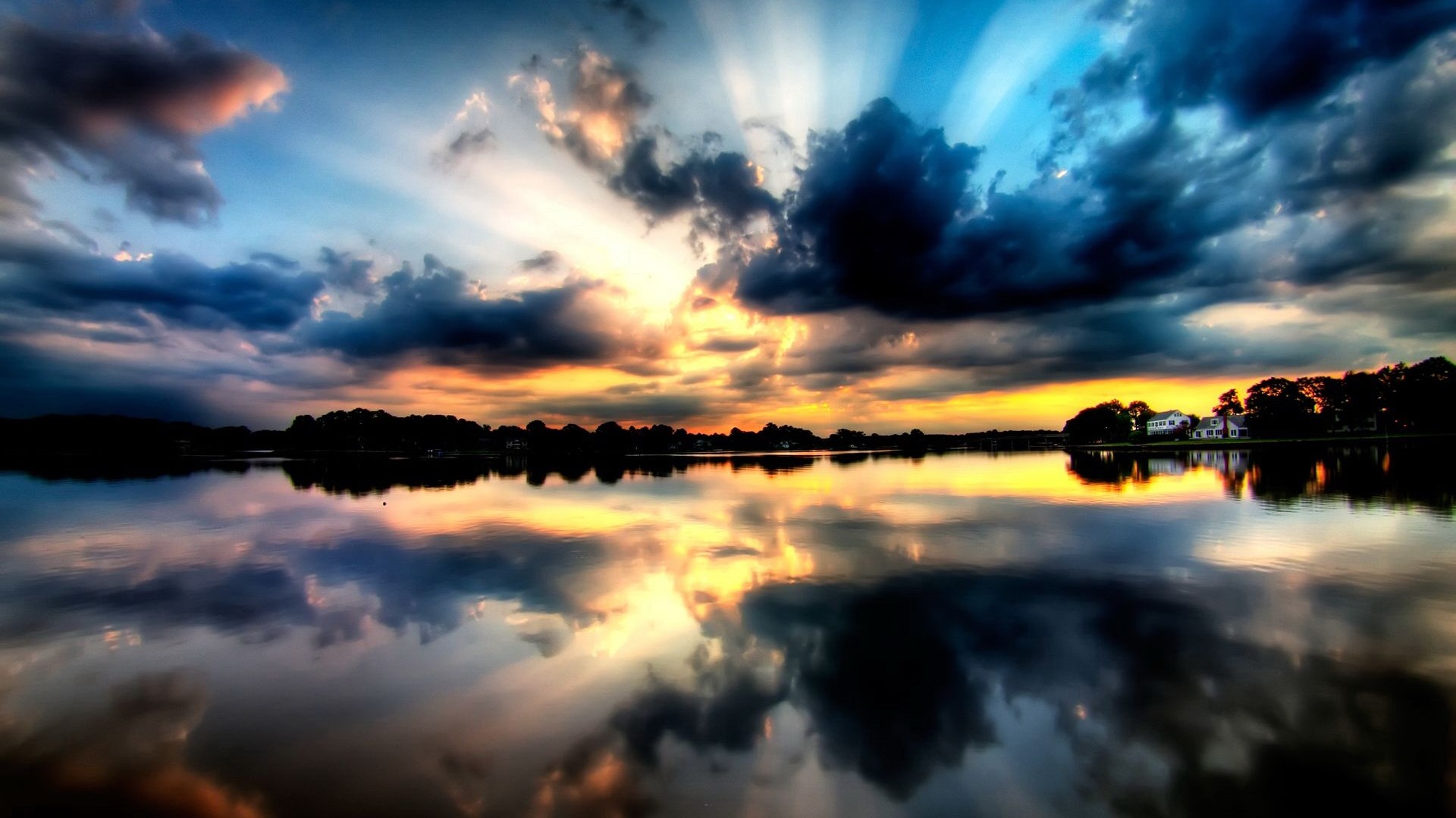Dramatic sunset over a lake with reflections HD Wallpaper