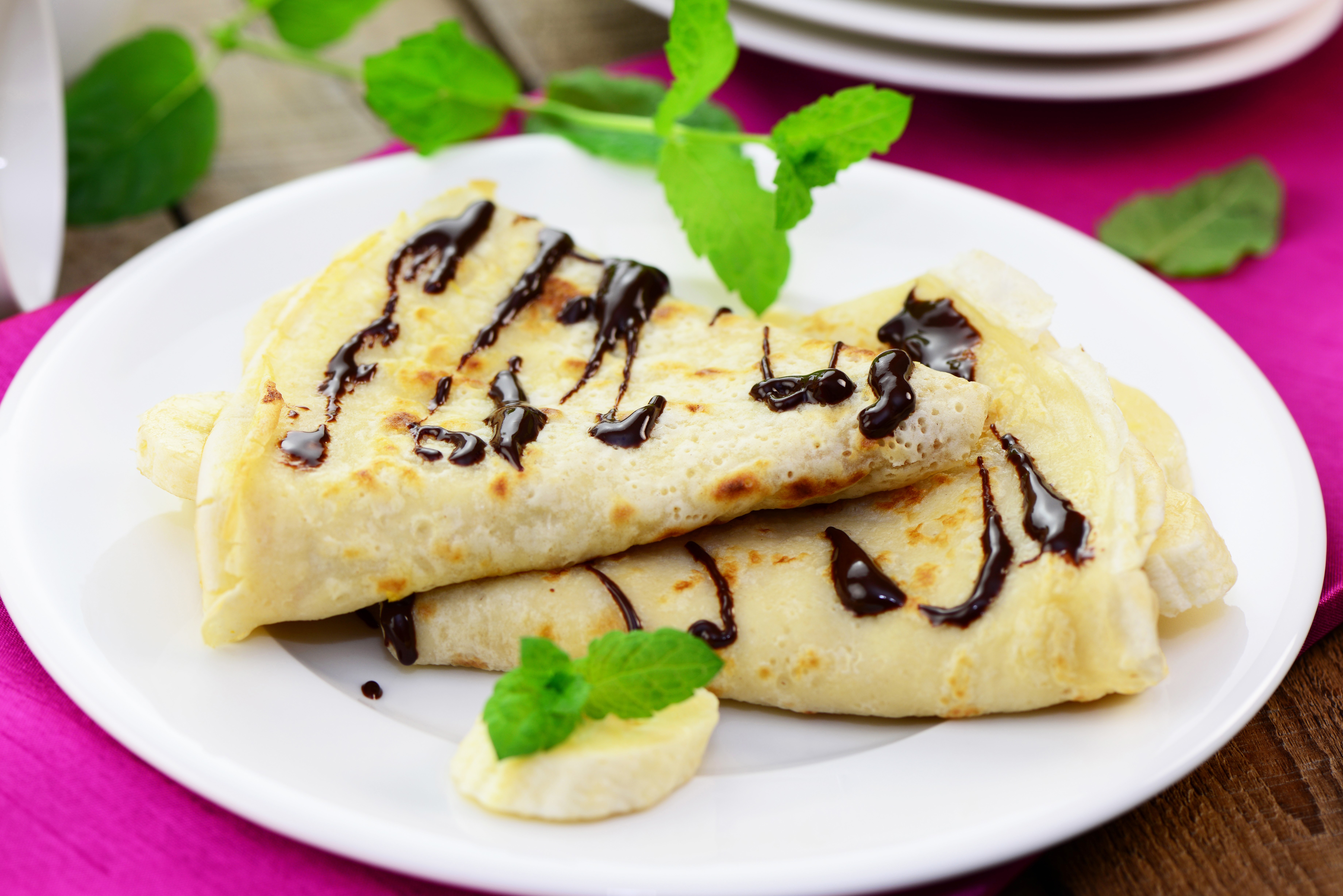 Pancakes with chocolate and banana on a plate HD Wallpaper