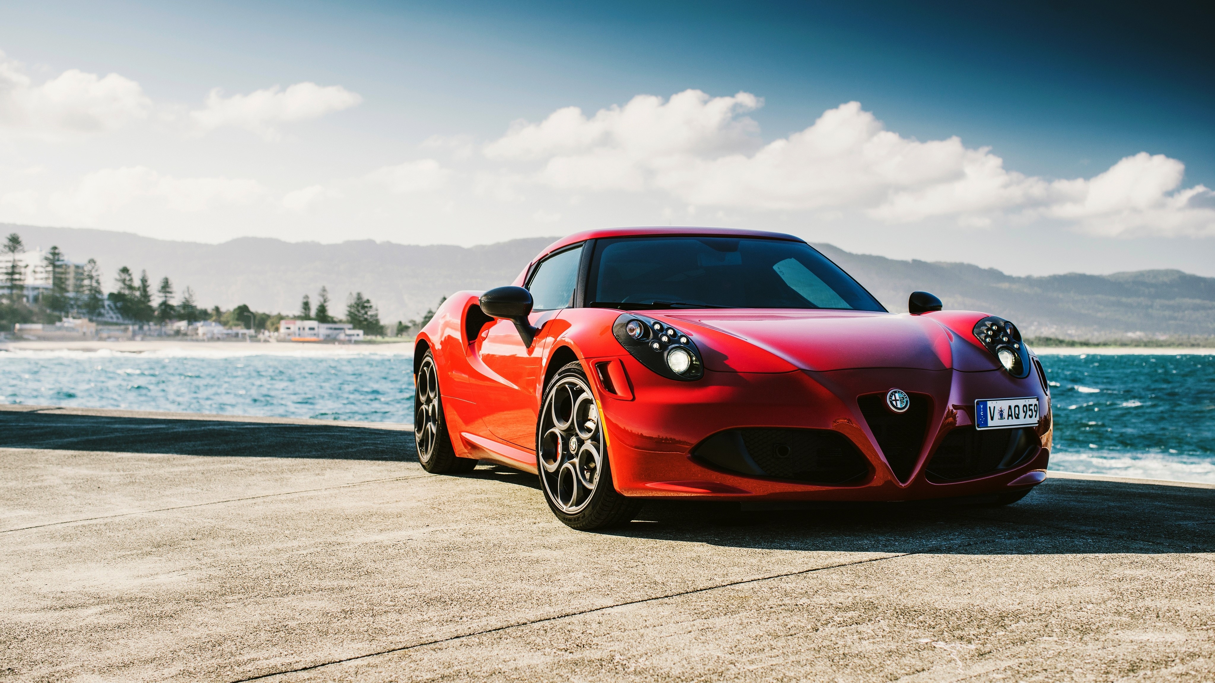 Red Alfa Romeo 4C parked by the sea HD Wallpaper