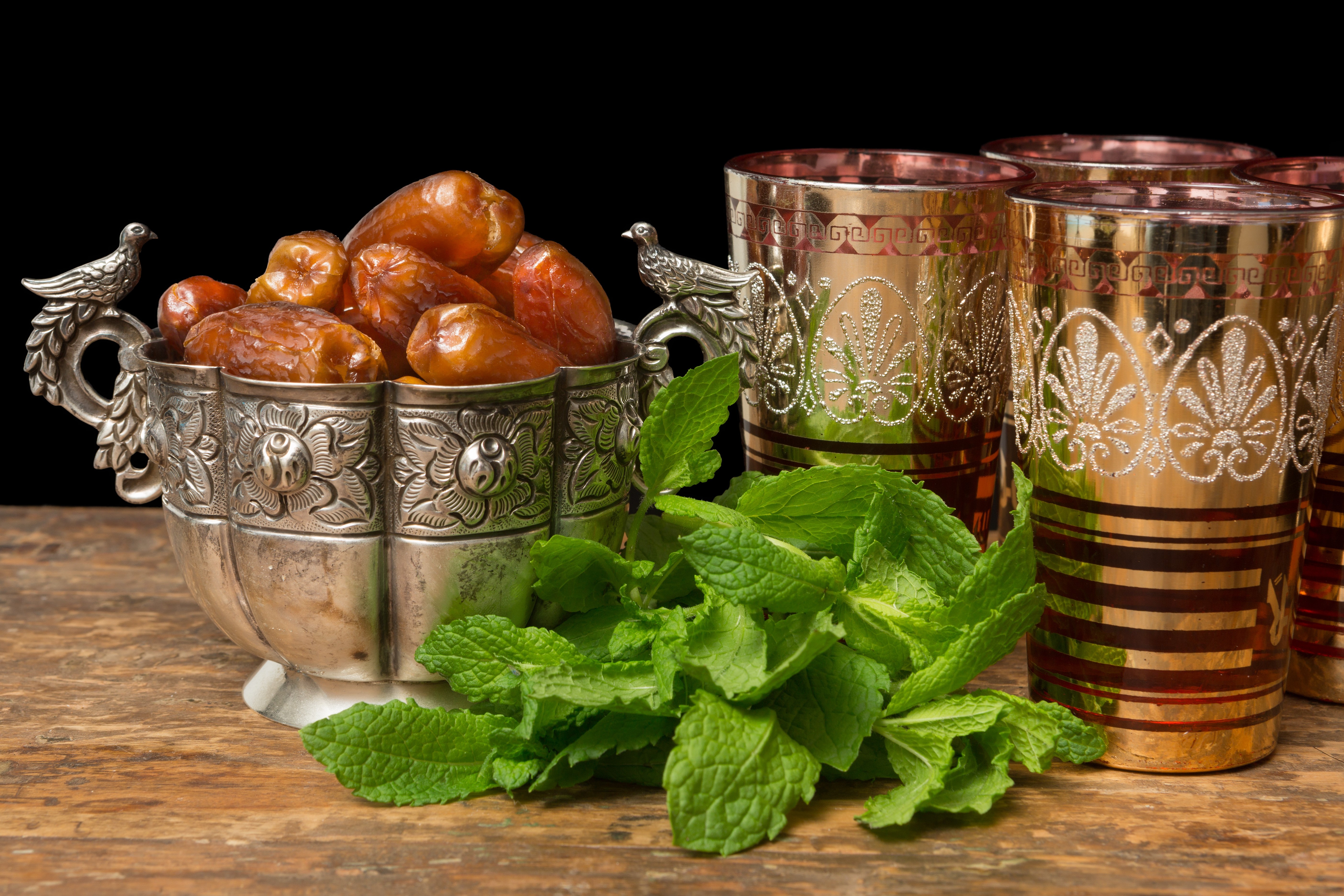 Dates in a silver bowl with mint and tea glasses HD Wallpaper