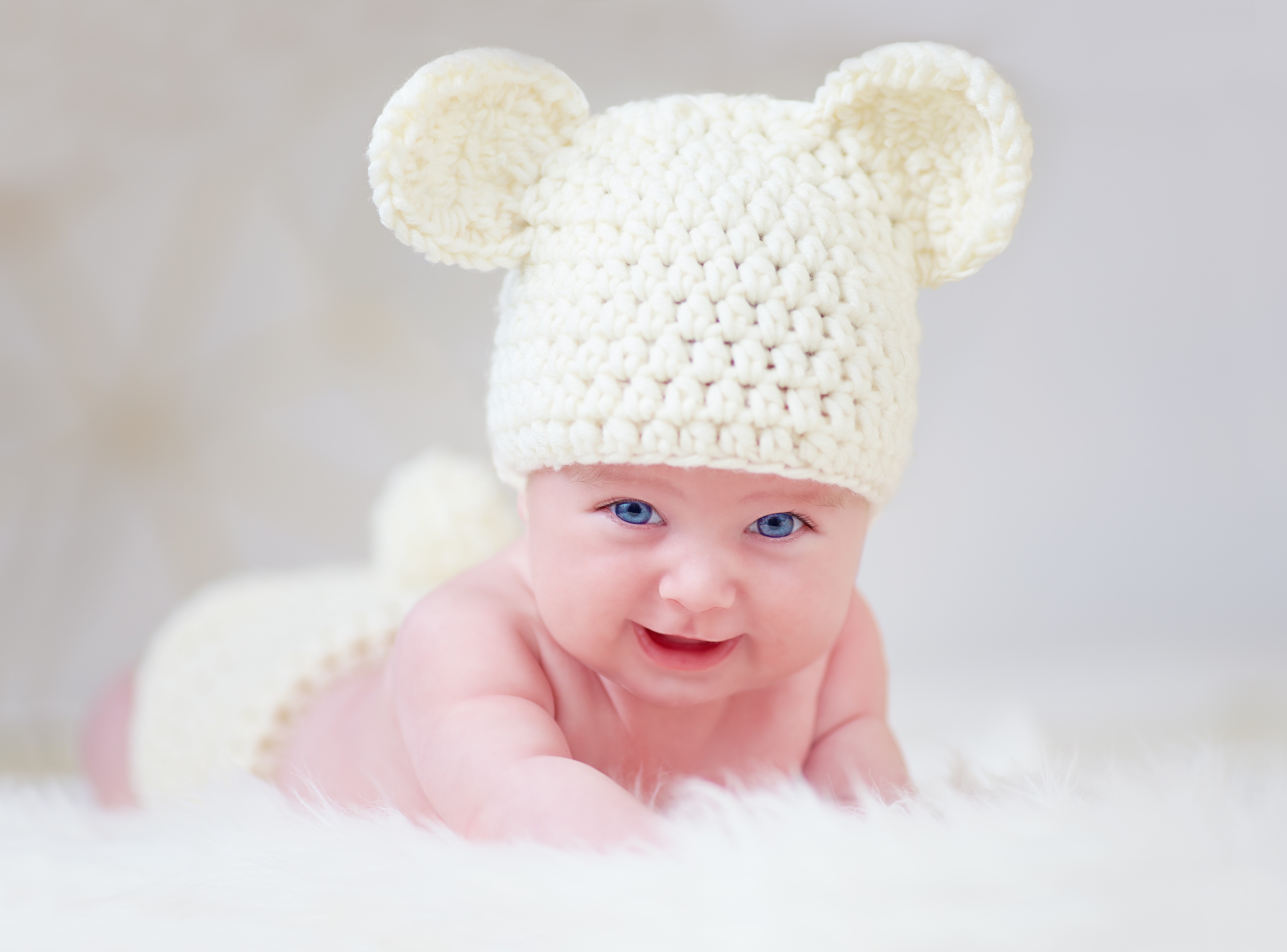 Baby wearing a crochet bear hat HD Wallpaper