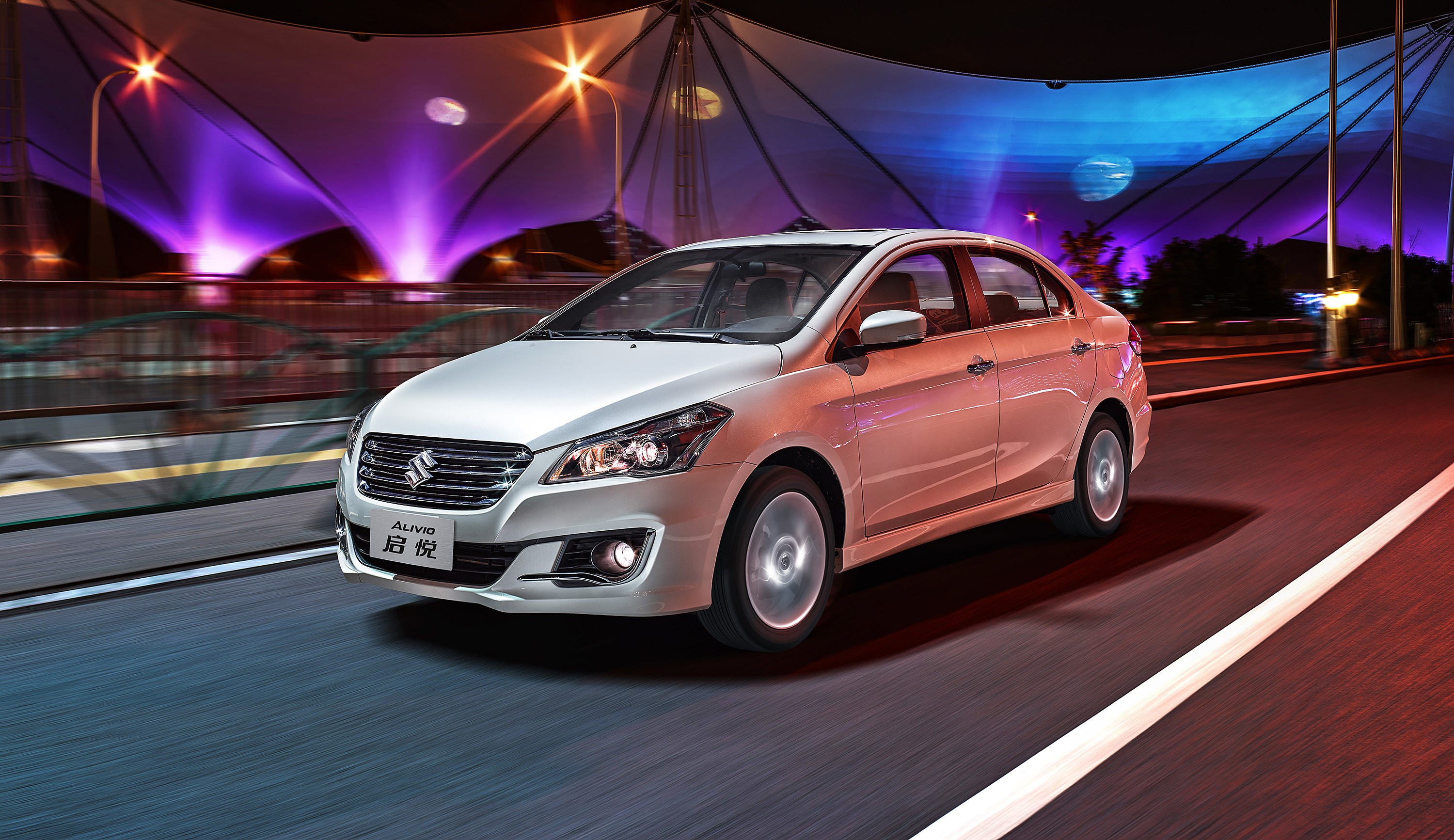 White Suzuki Alivio driving at night HD Wallpaper
