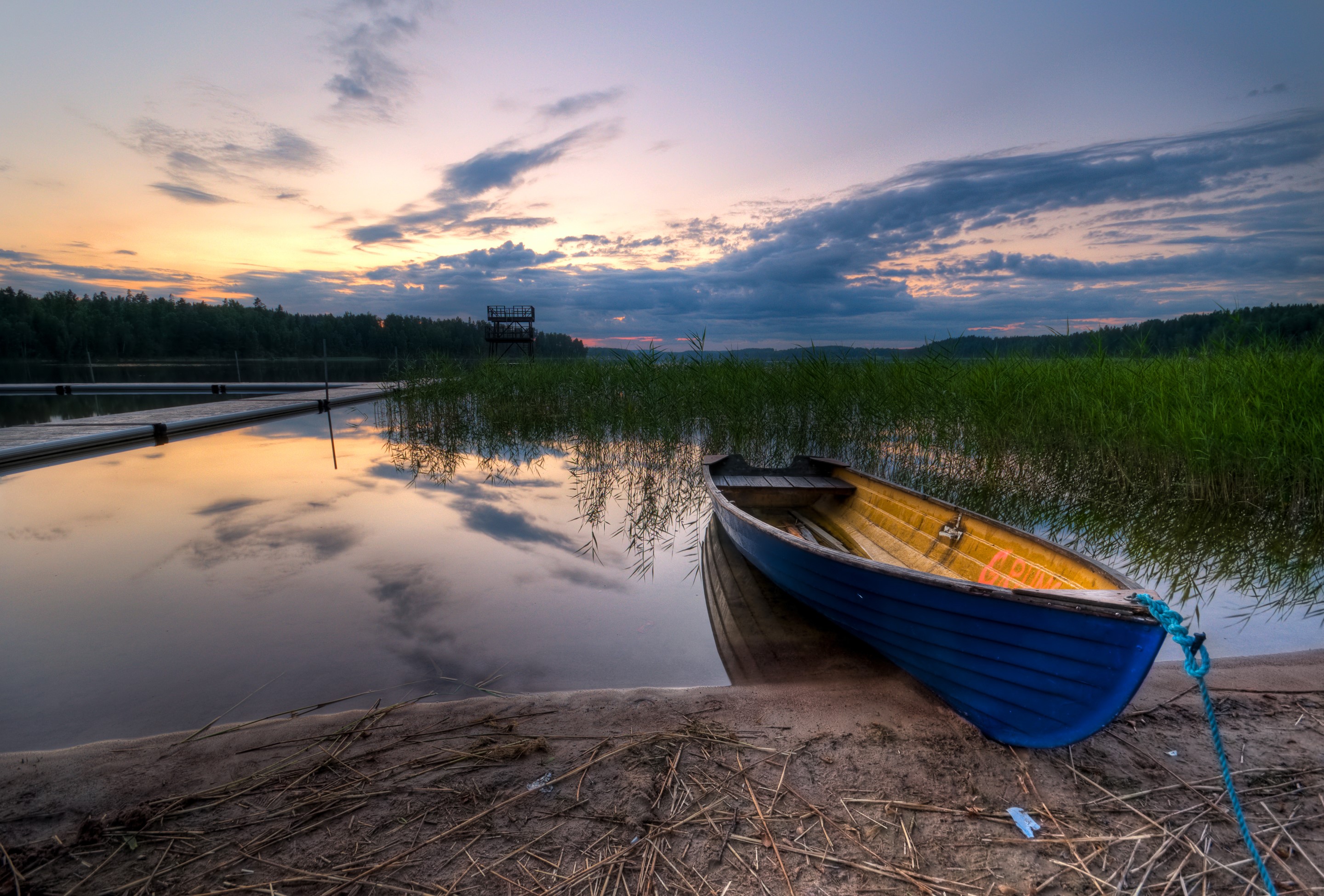 Boat on a lake at sunset with a pier HD Wallpaper