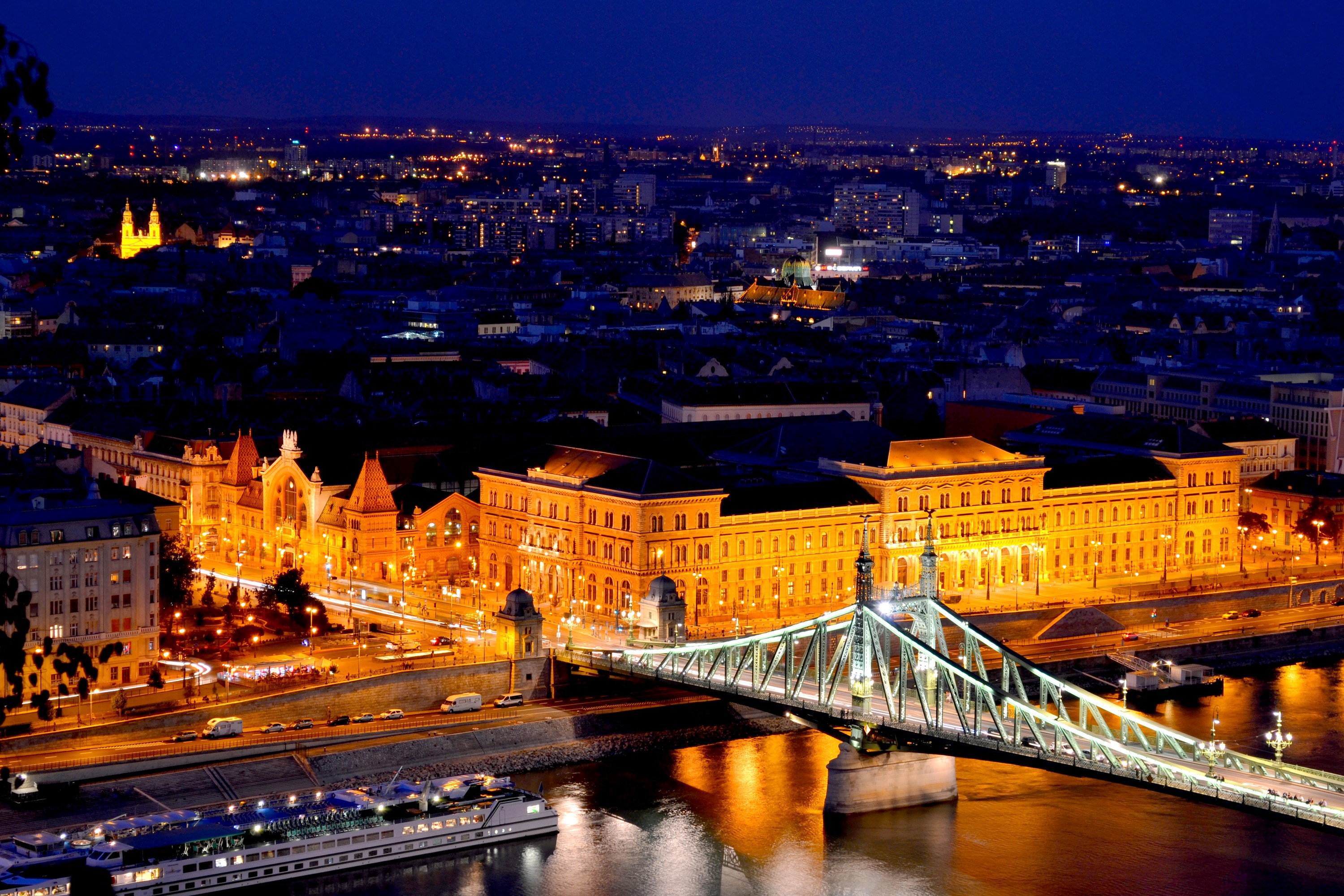 Budapest at night with illuminated bridge and river HD Wallpaper