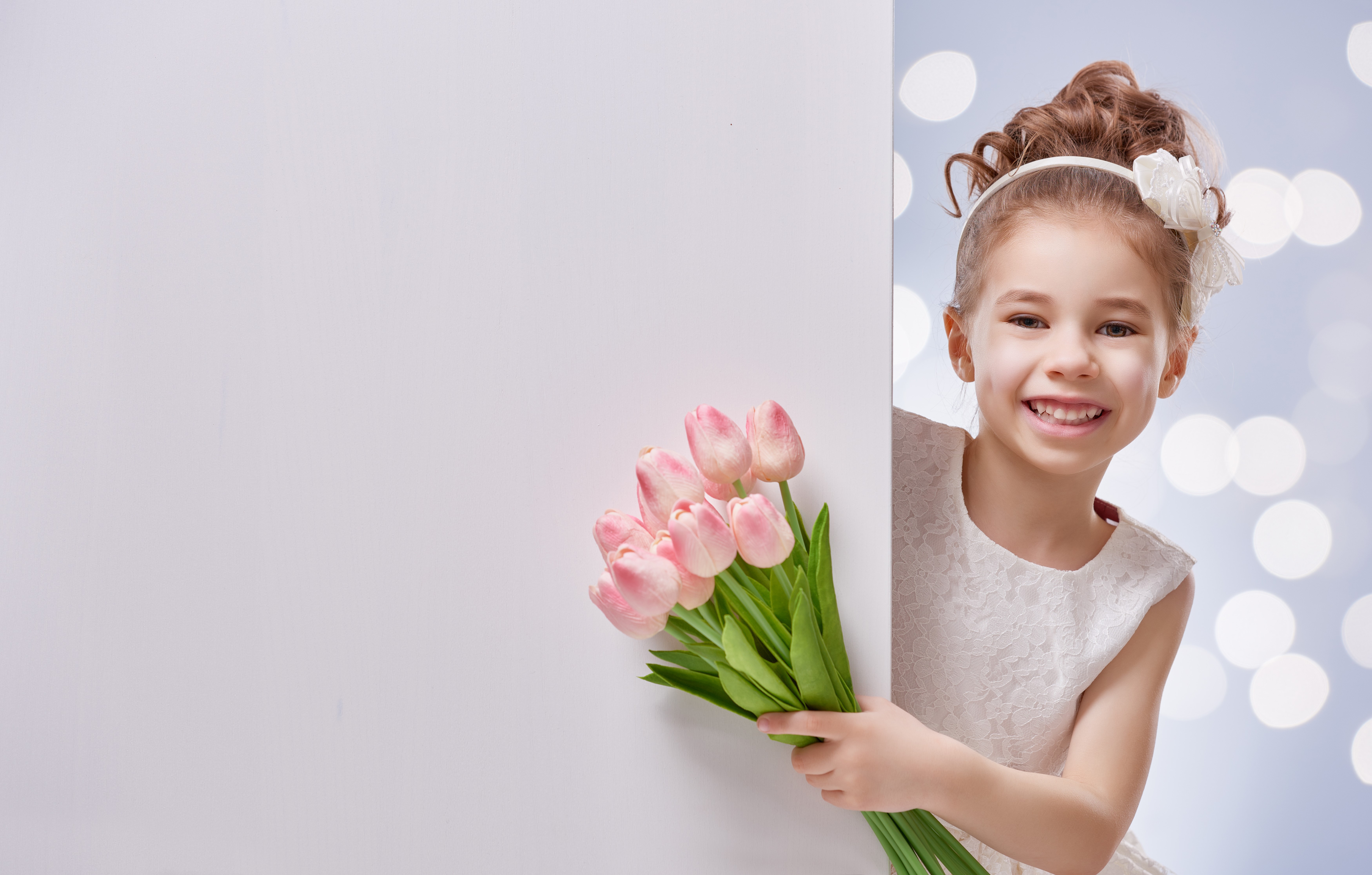 Girl holding pink tulips HD Wallpaper