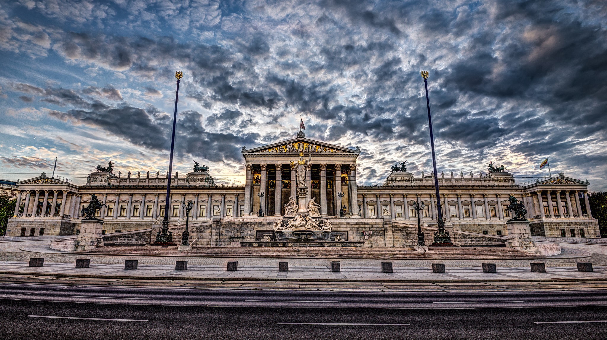 Austrian Parliament Building in Vienna with Dramatic Clouds HD Wallpaper