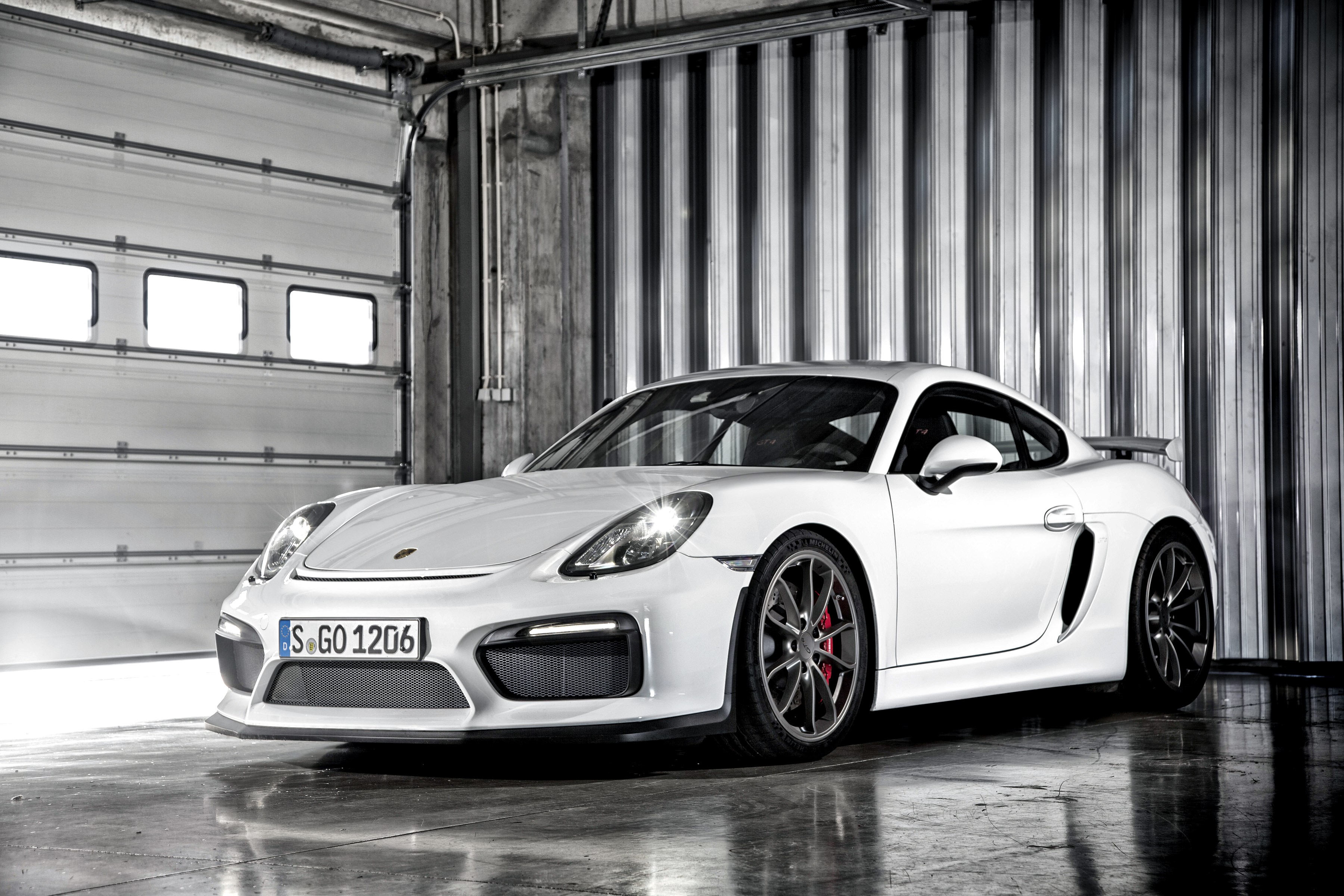 White 2015 Porsche Cayman GT4 in garage HD Wallpaper