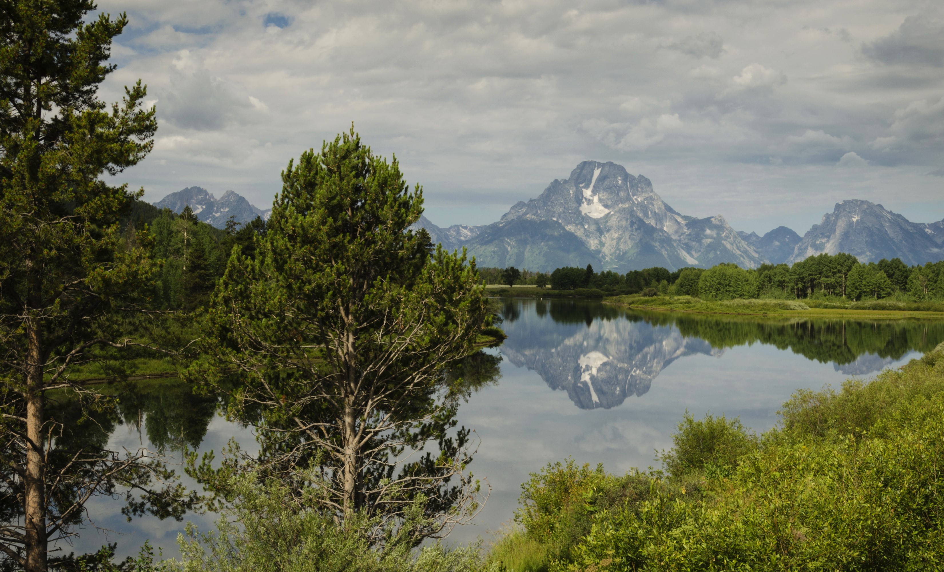Mount Moran reflected in a lake in Grand Teton National Park, Wyoming HD Wallpaper