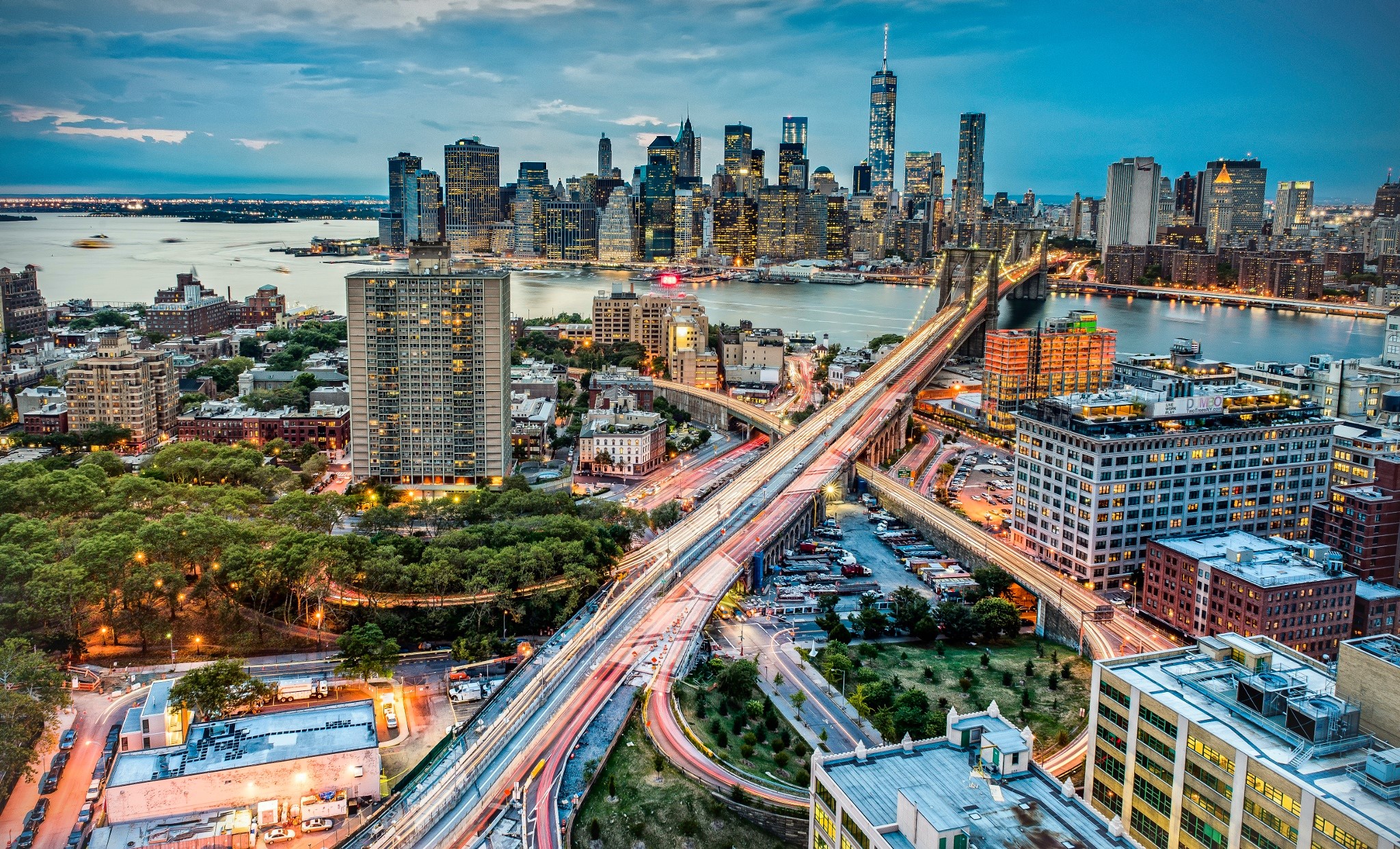 New York City skyline with Brooklyn Bridge at dusk HD Wallpaper