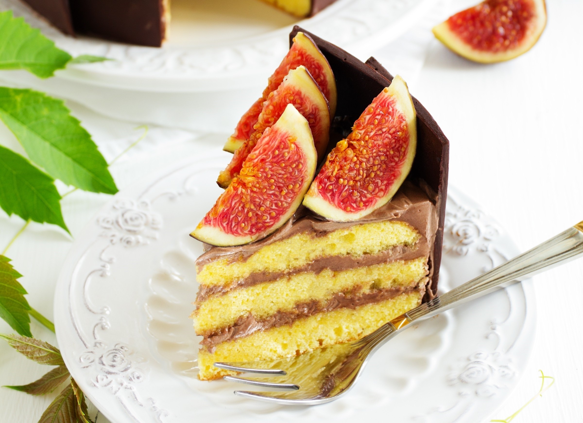 Slice of chocolate fig cake with fork HD Wallpaper
