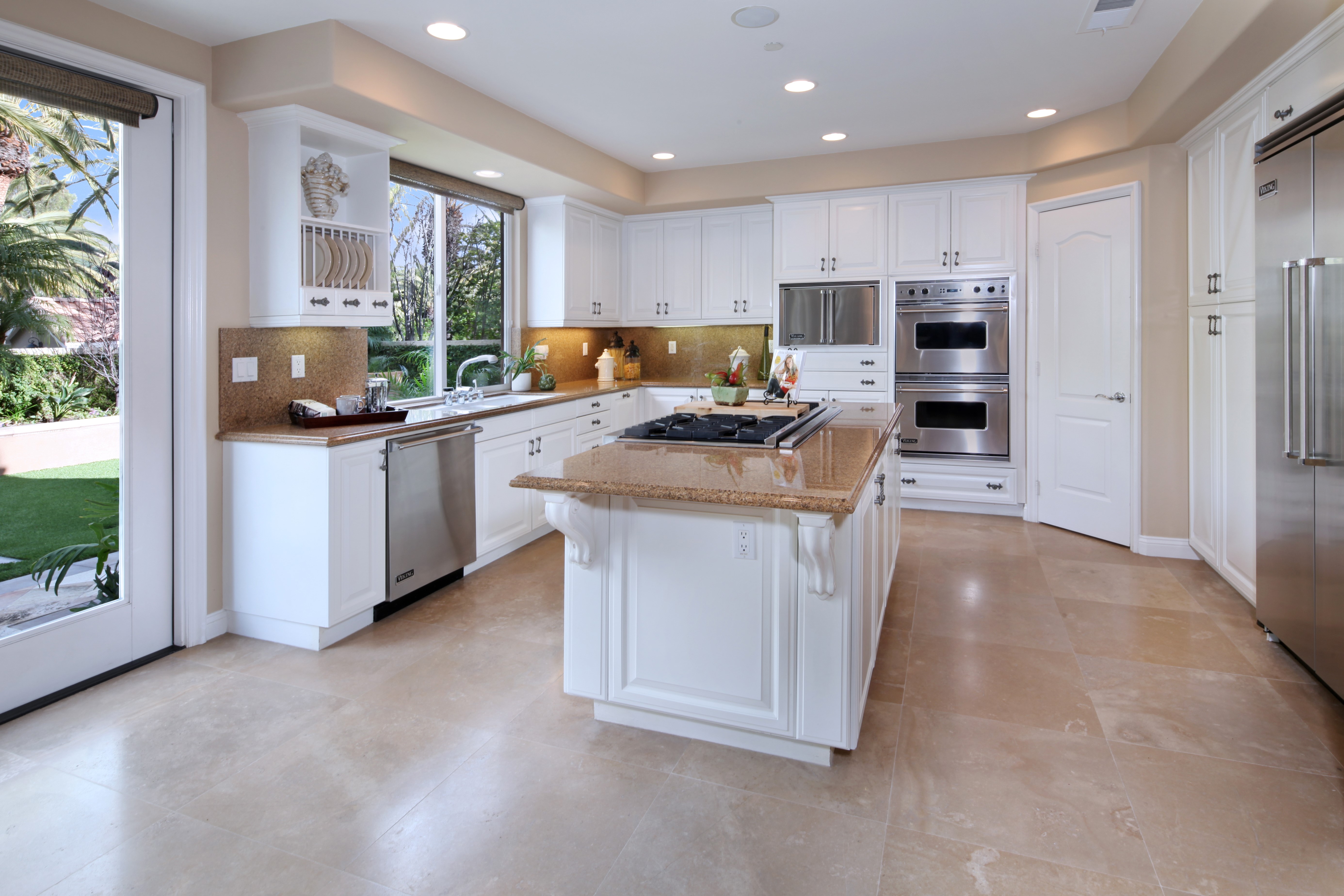 Modern Kitchen with Island and Stainless Steel Appliances HD Wallpaper