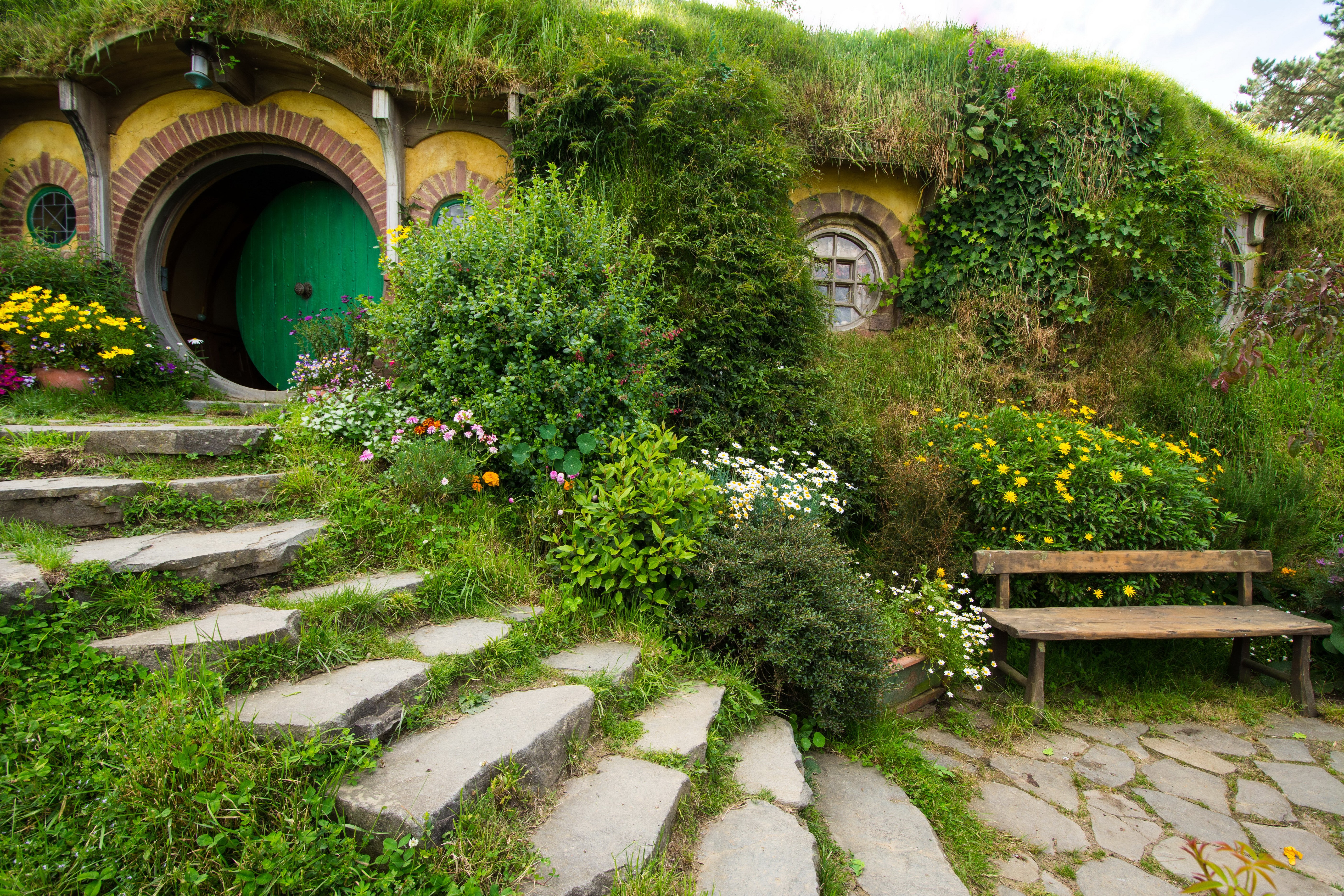 Matamata Hobbiton Park New Zealand with stairs and bench HD Wallpaper