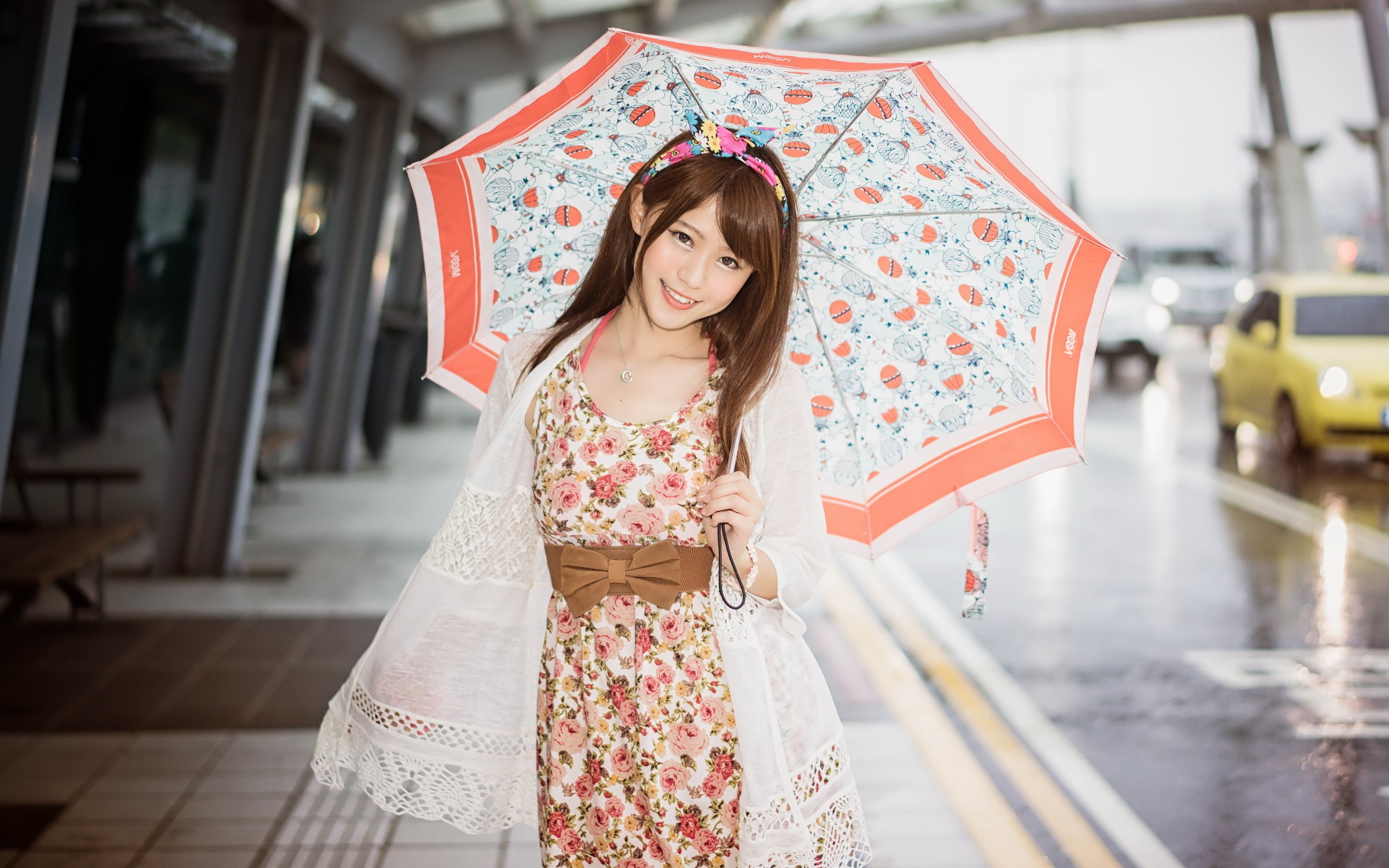 Asian woman with umbrella on a rainy street HD Wallpaper
