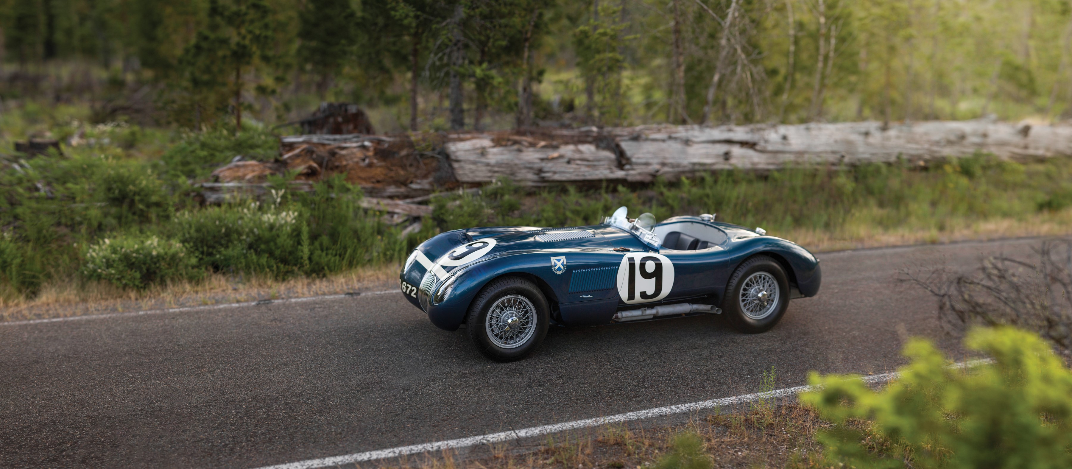 1951 Jaguar C-Type race car on a road HD Wallpaper