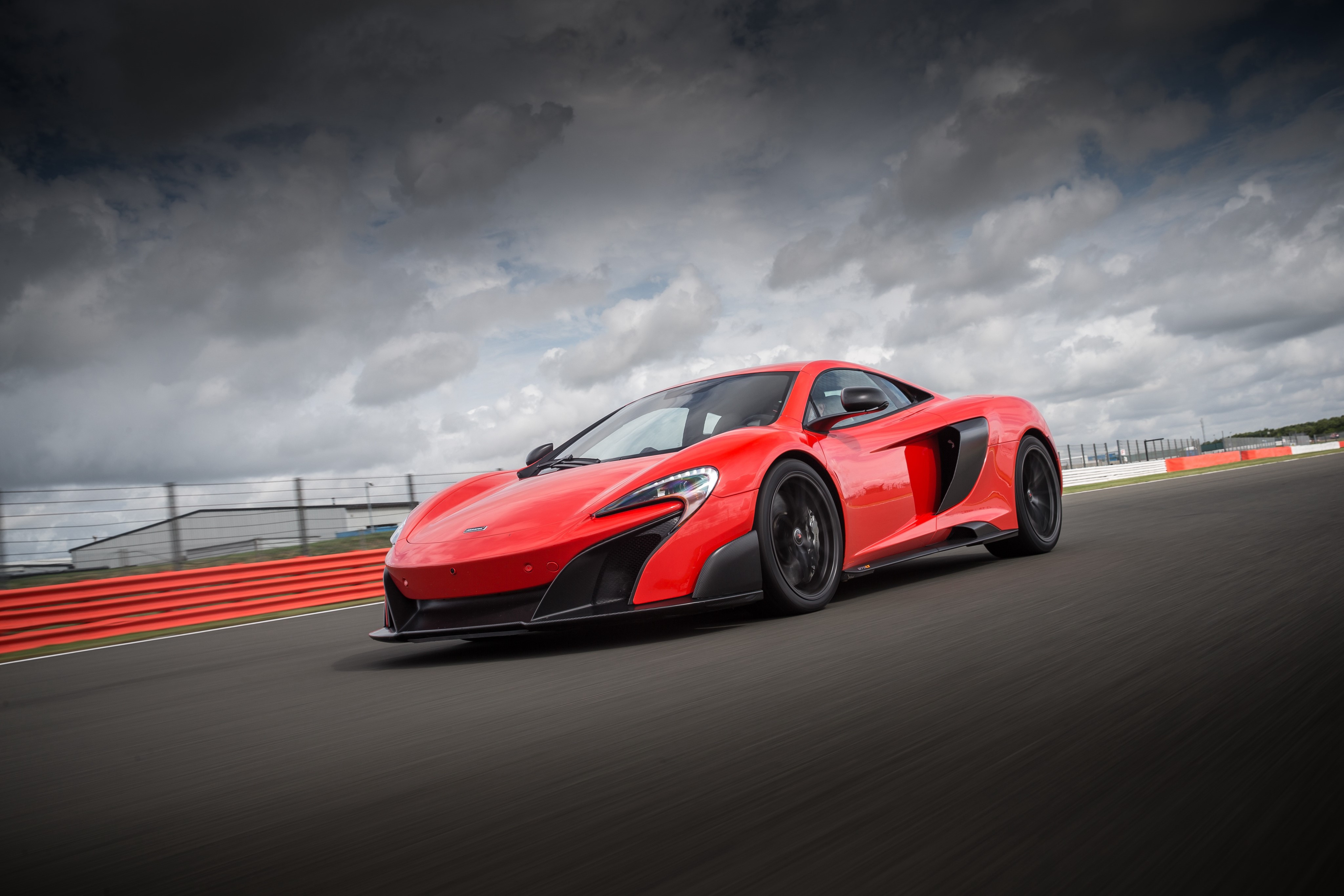 Red McLaren 675LT on a Racetrack HD Wallpaper