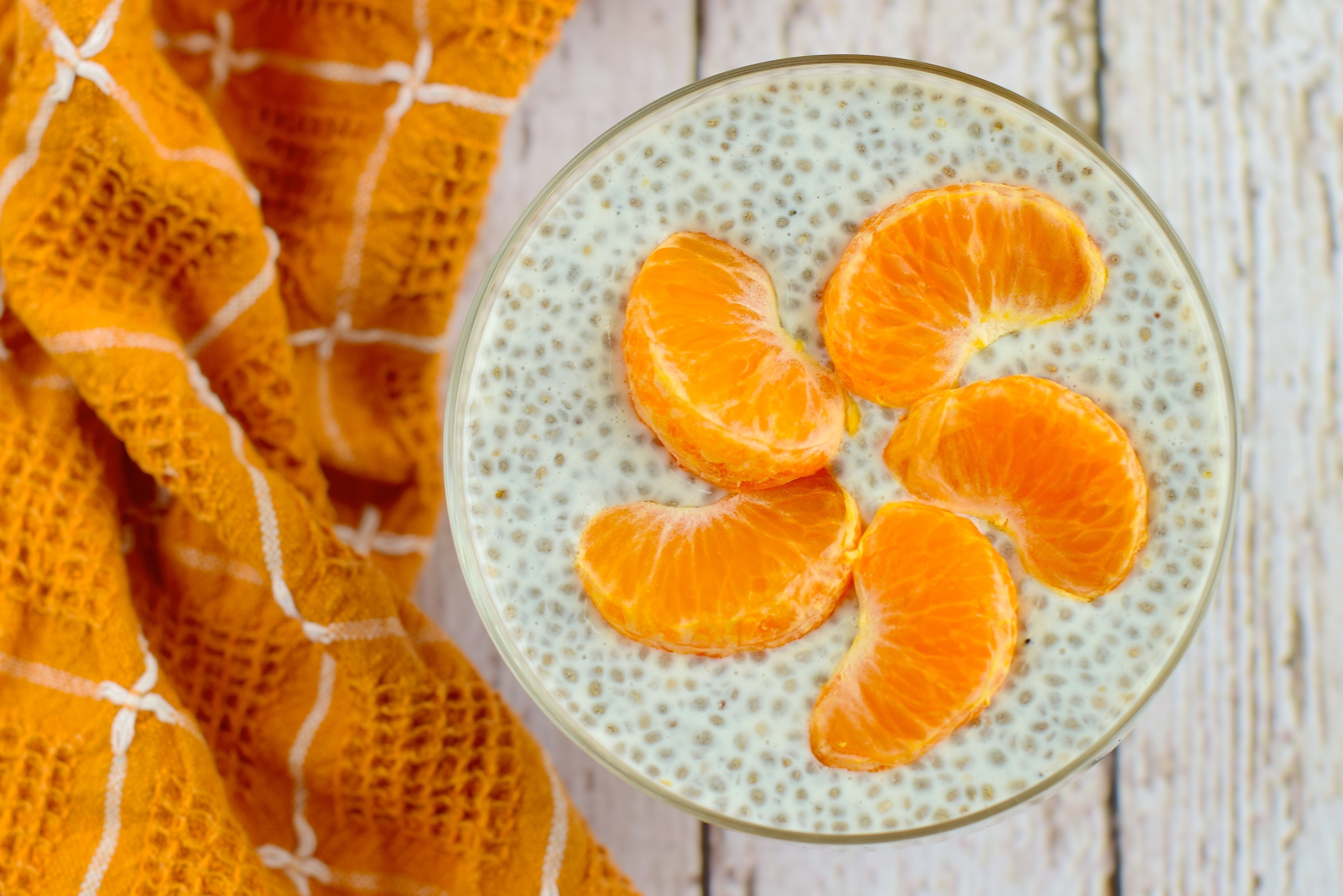 Chia pudding with orange slices and orange cloth HD Wallpaper