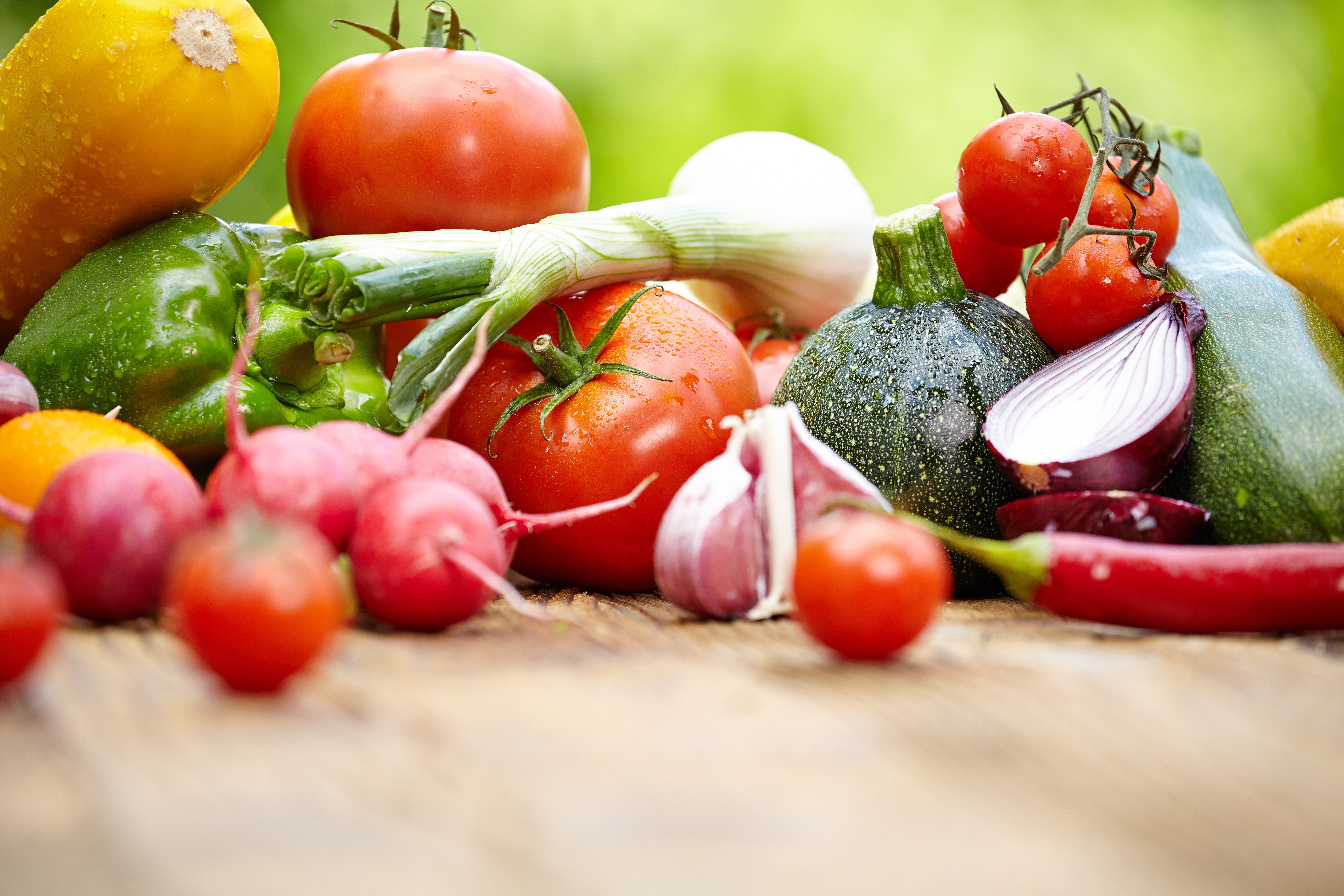 Assortment of fresh vegetables including tomatoes, onions, and radishes HD Wallpaper