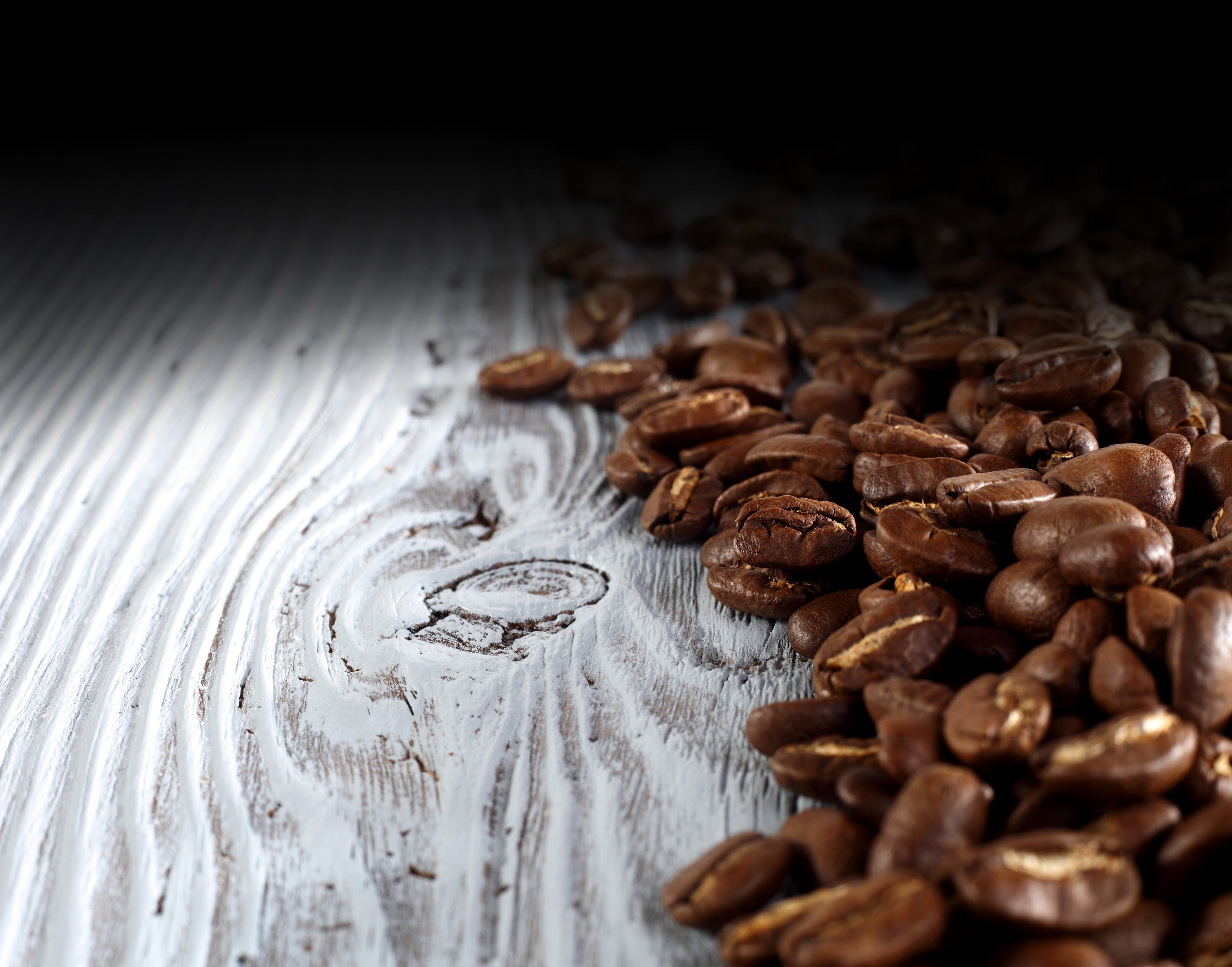 Coffee beans on a wooden surface HD Wallpaper