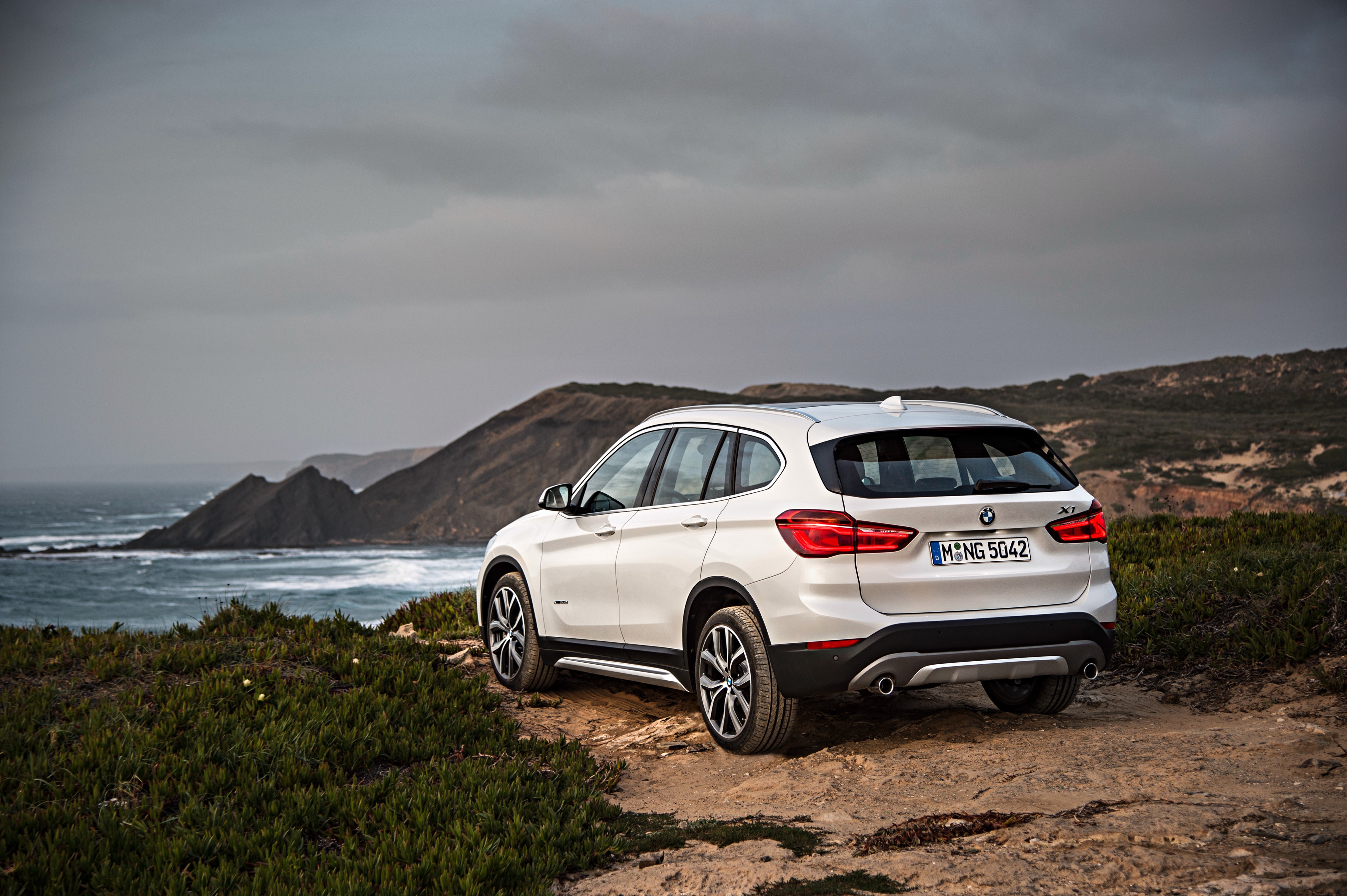 White BMW X1 xDrive xLine F48 parked by the sea HD Wallpaper