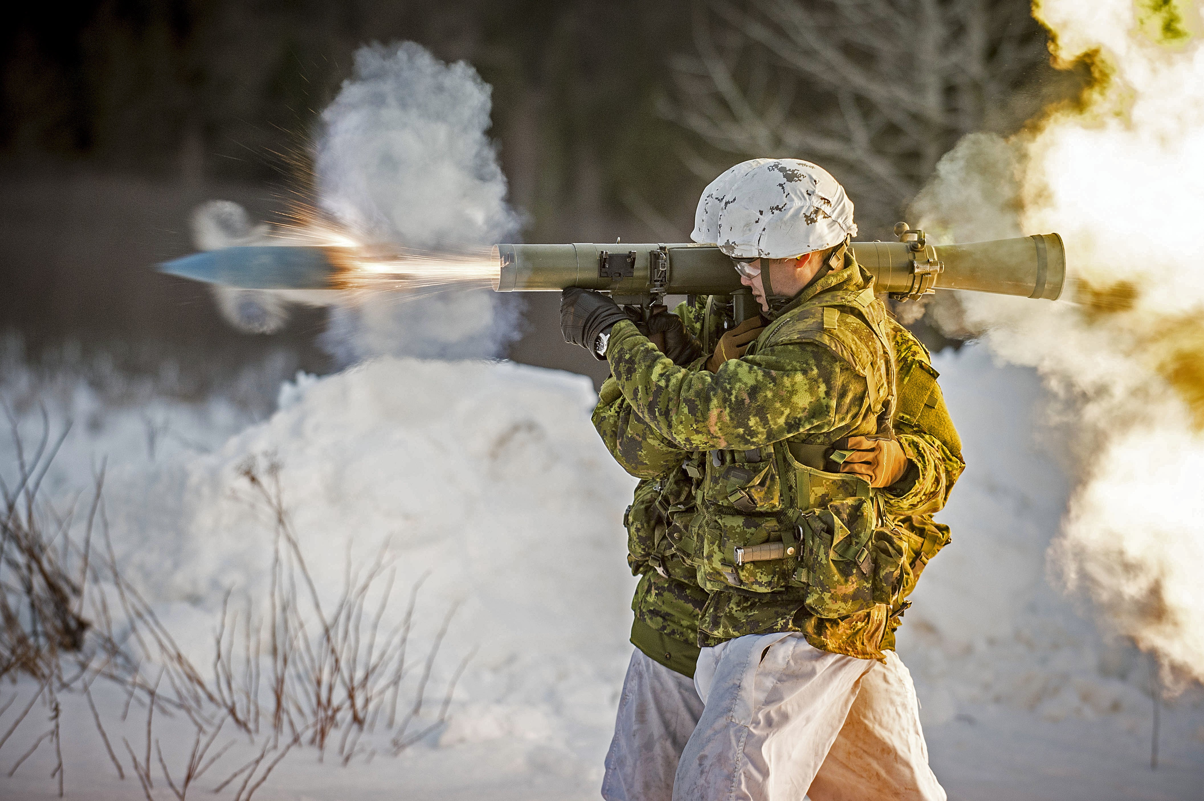 Soldier firing 84mm grenade launcher during Exercise RAFALE BLANCHE HD Wallpaper
