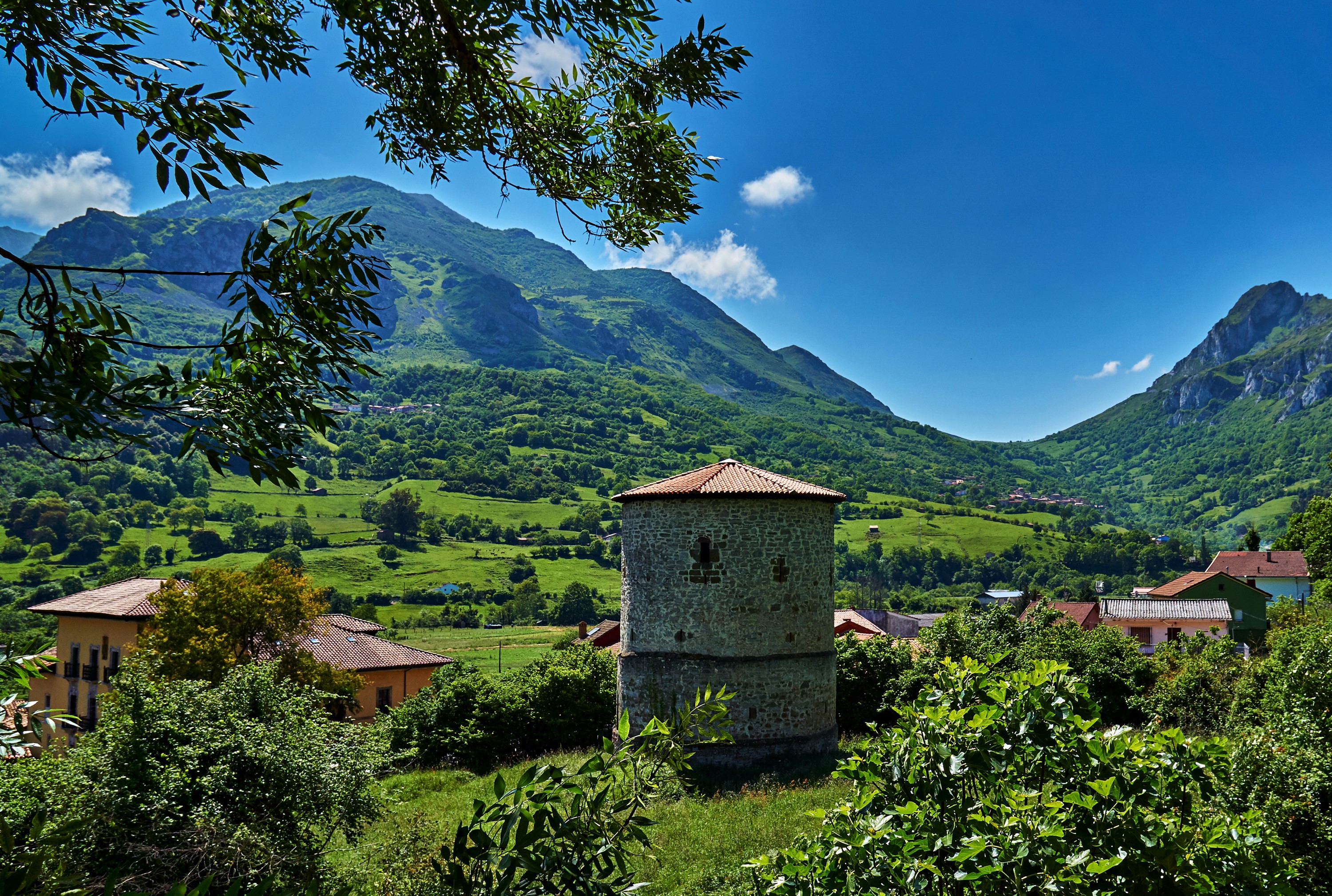 Stone tower in Proaza, Asturias, Spain with mountains HD Wallpaper