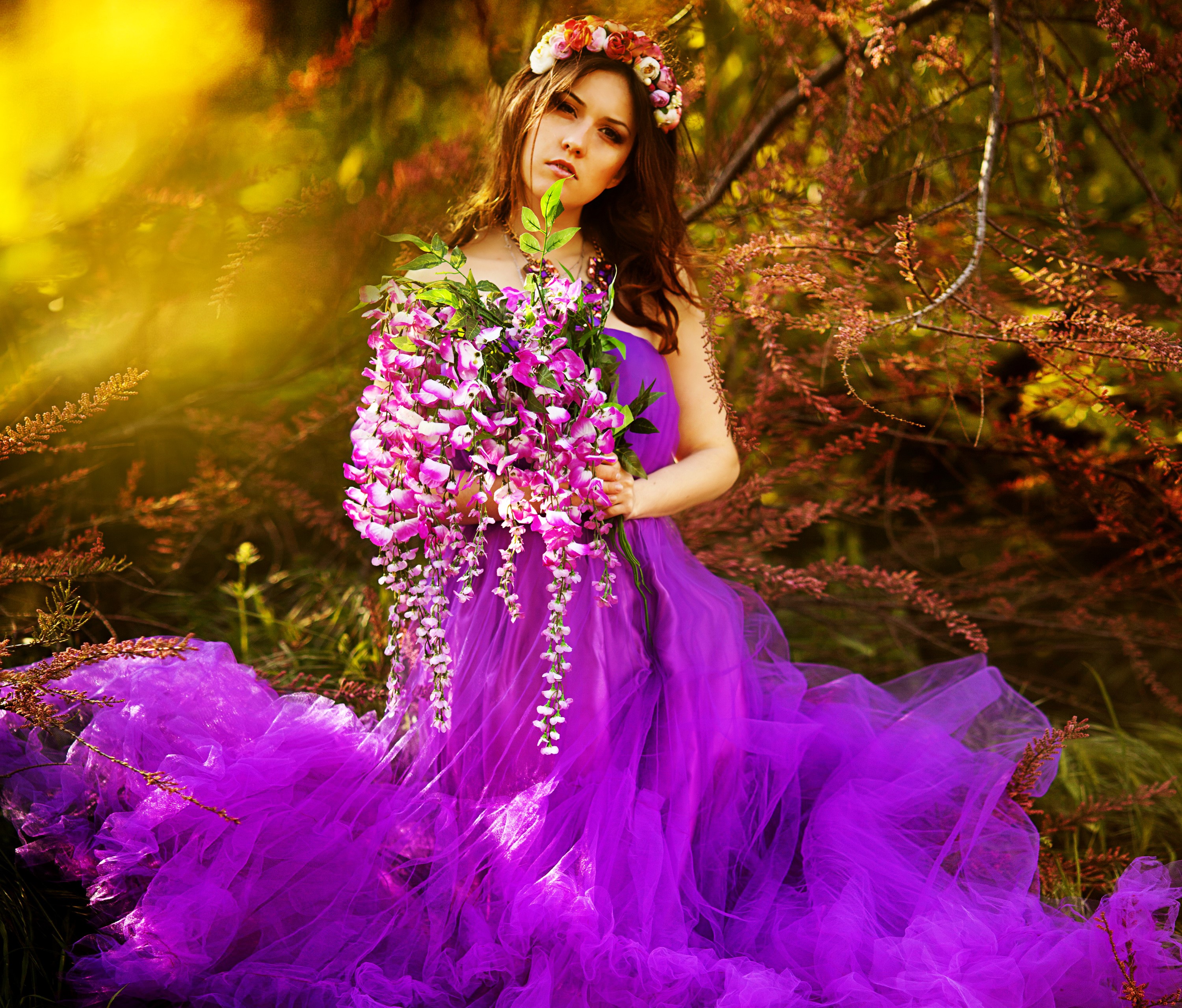 Woman in purple dress holding flowers HD Wallpaper