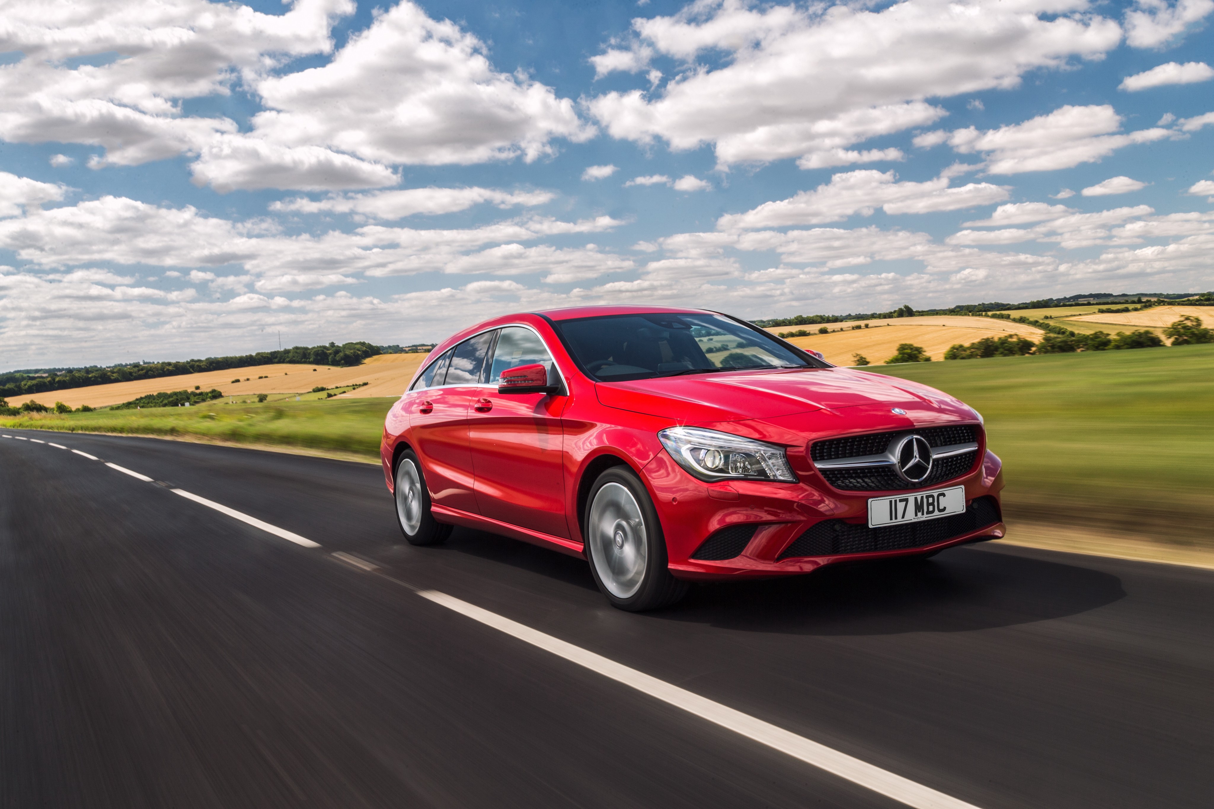 Red Mercedes-Benz CLA-Class X117 driving on a road HD Wallpaper