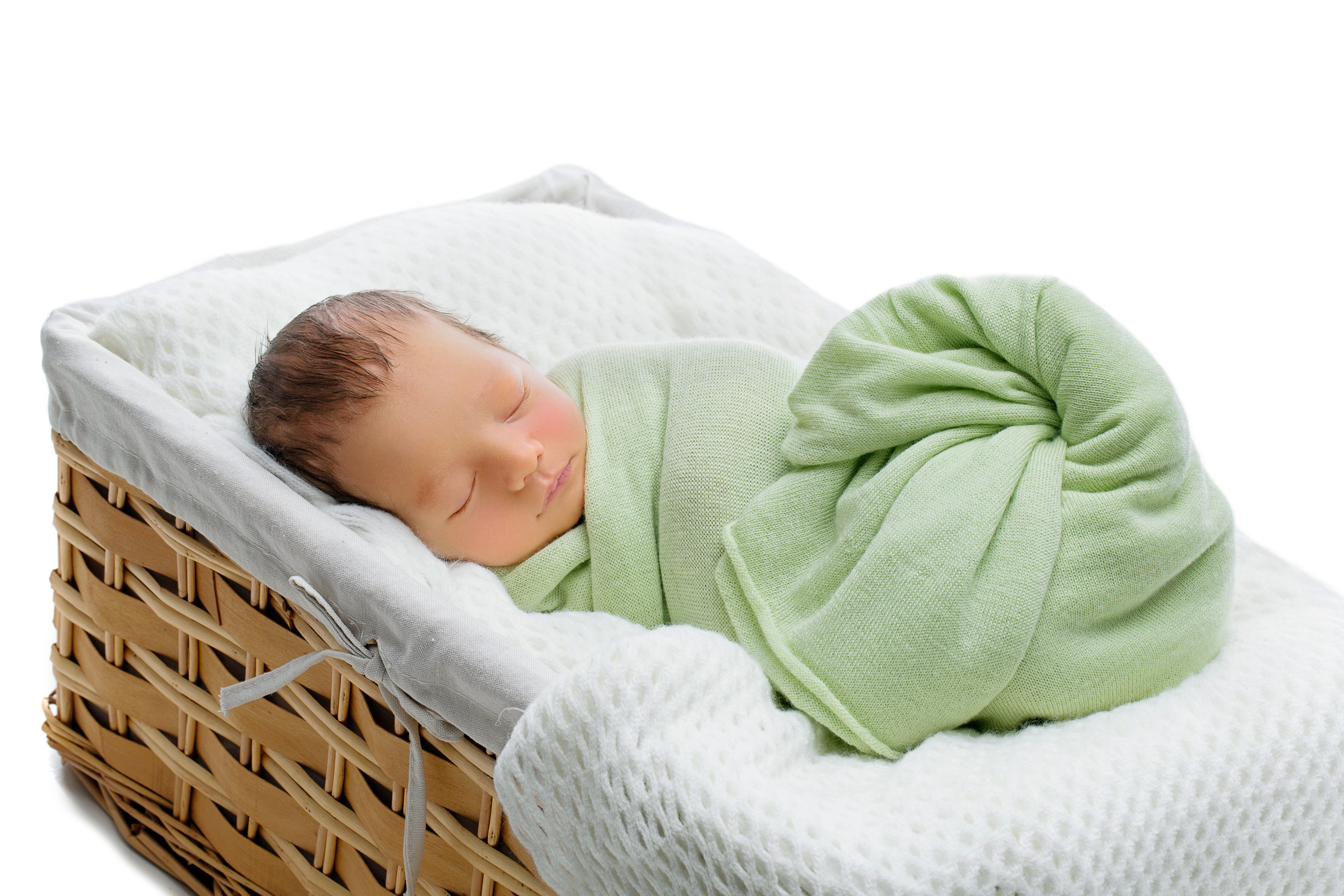 Newborn baby sleeping in a wicker basket HD Wallpaper