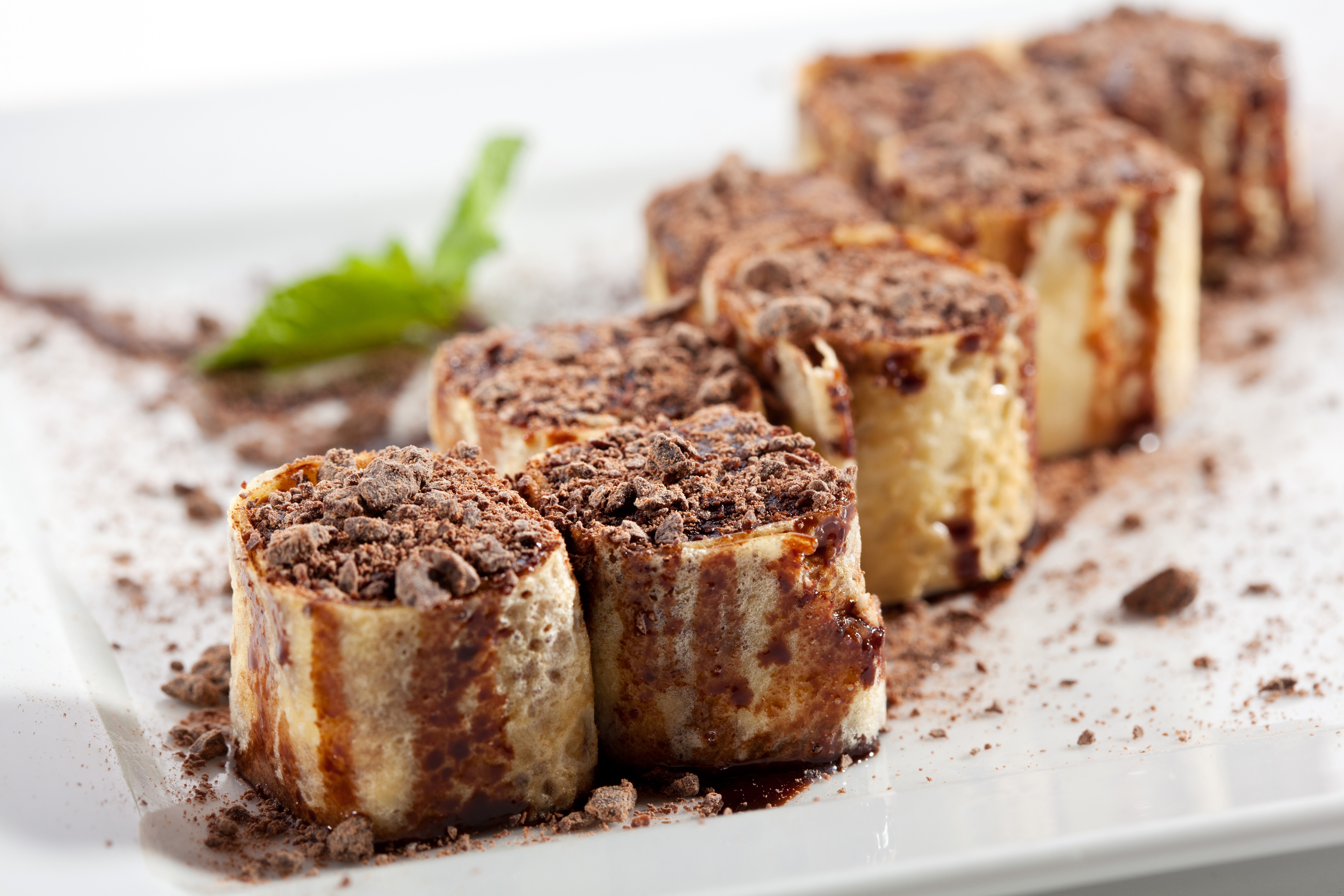 Chocolate covered pancakes with mint leaf HD Wallpaper