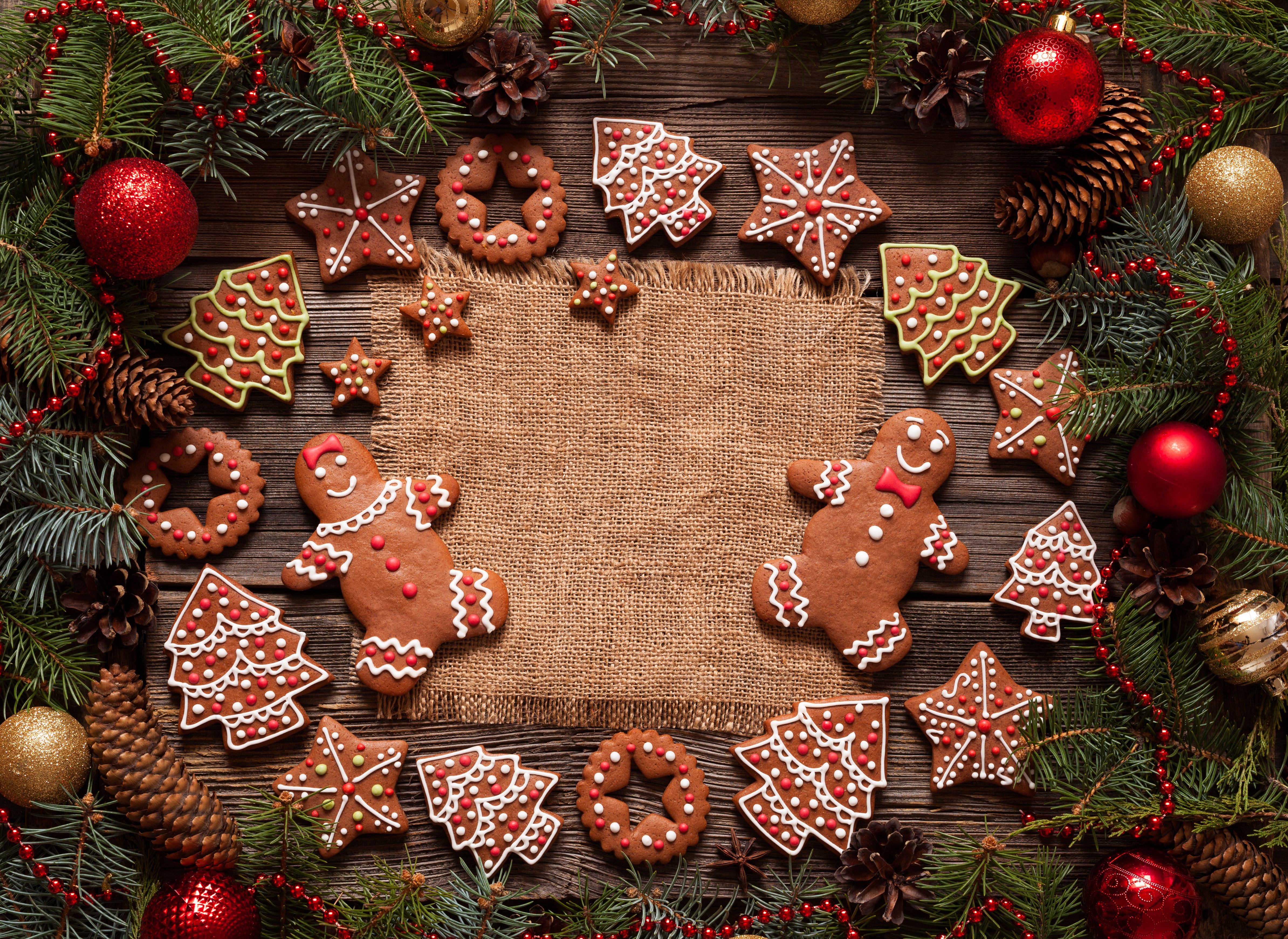 Christmas cookies and decorations on wooden table HD Wallpaper