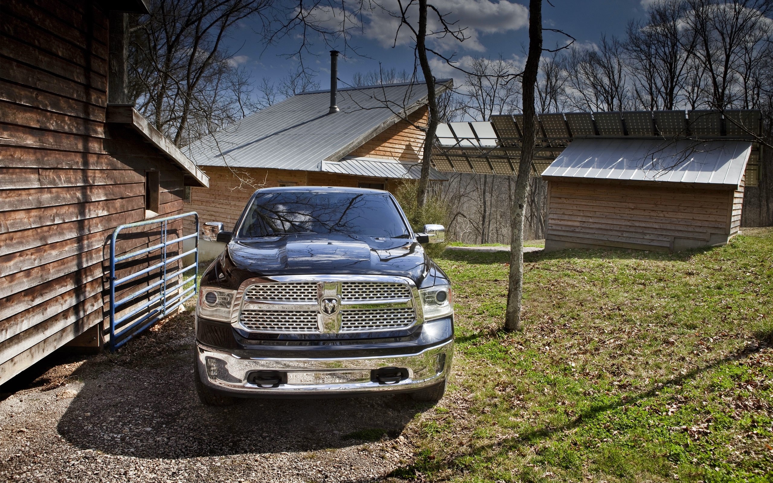 Ram 1500 truck parked near wooden buildings HD Wallpaper