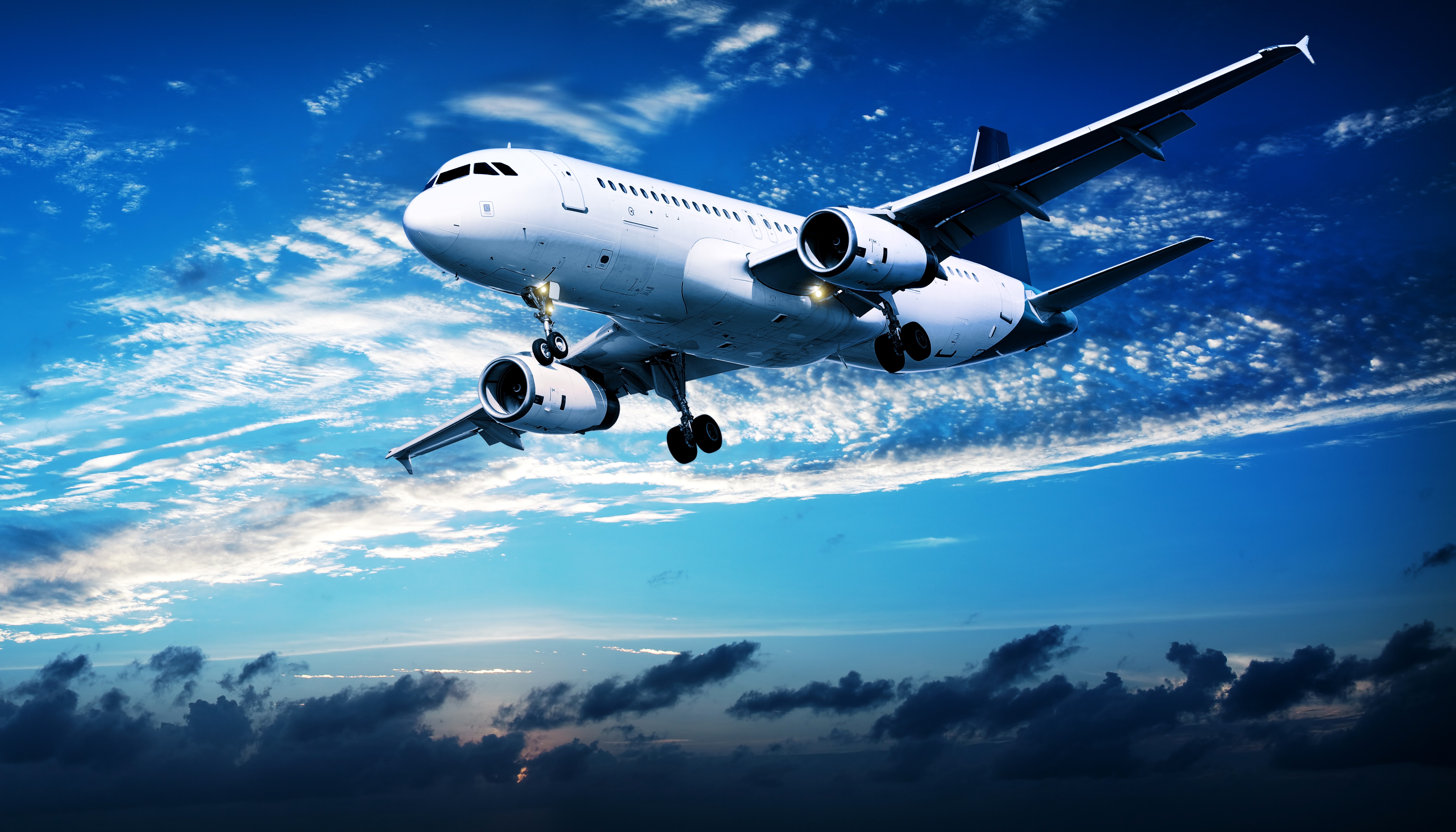 Airplane flying in the sky with clouds HD Wallpaper