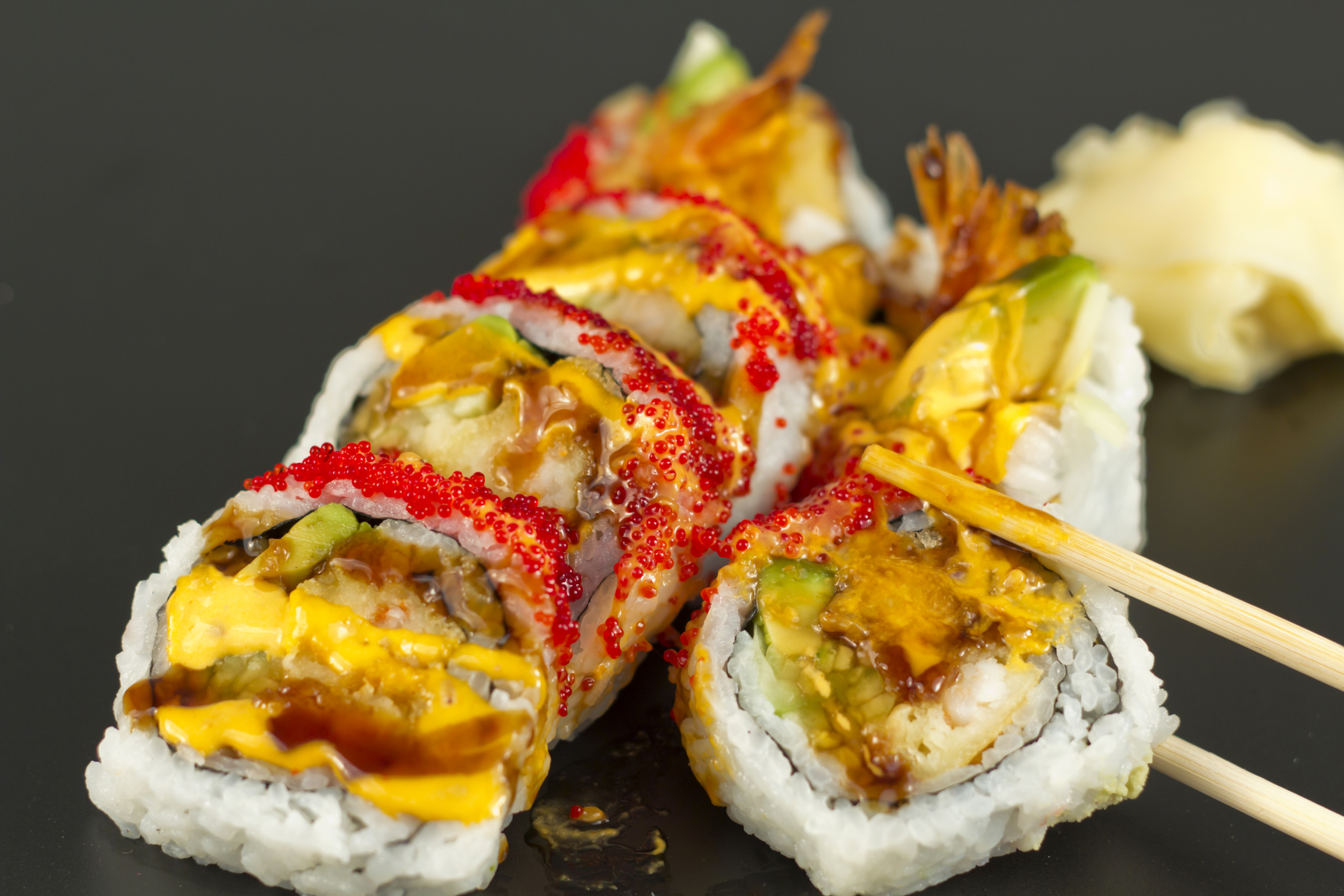 Sushi rolls with shrimp, avocado, and sauce HD Wallpaper