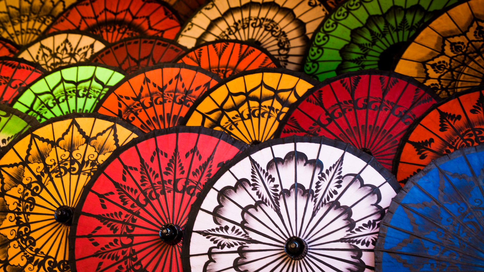 Colorful patterned umbrellas arranged in a fan shape HD Wallpaper