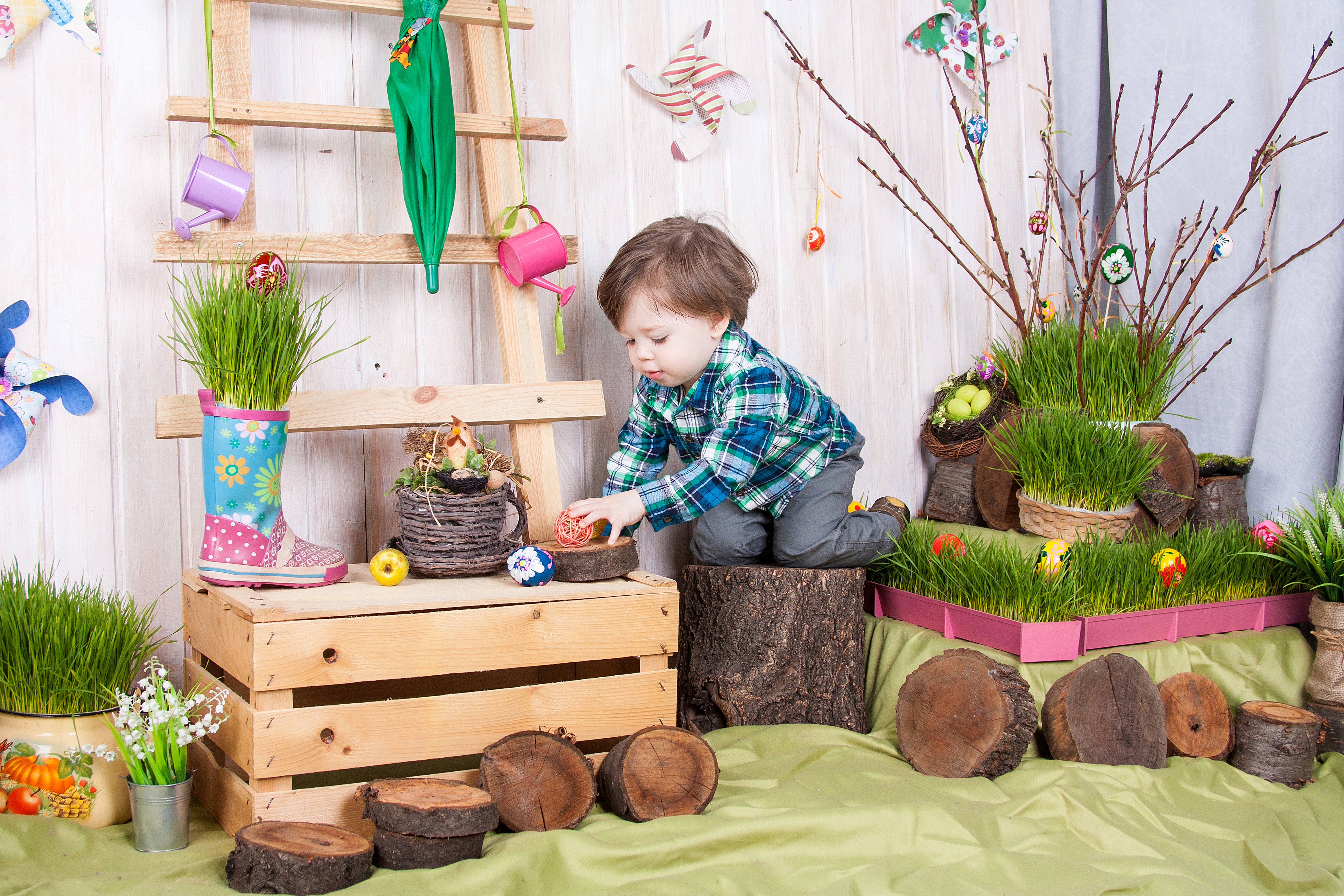 Boy playing with Easter eggs near a ladder HD Wallpaper