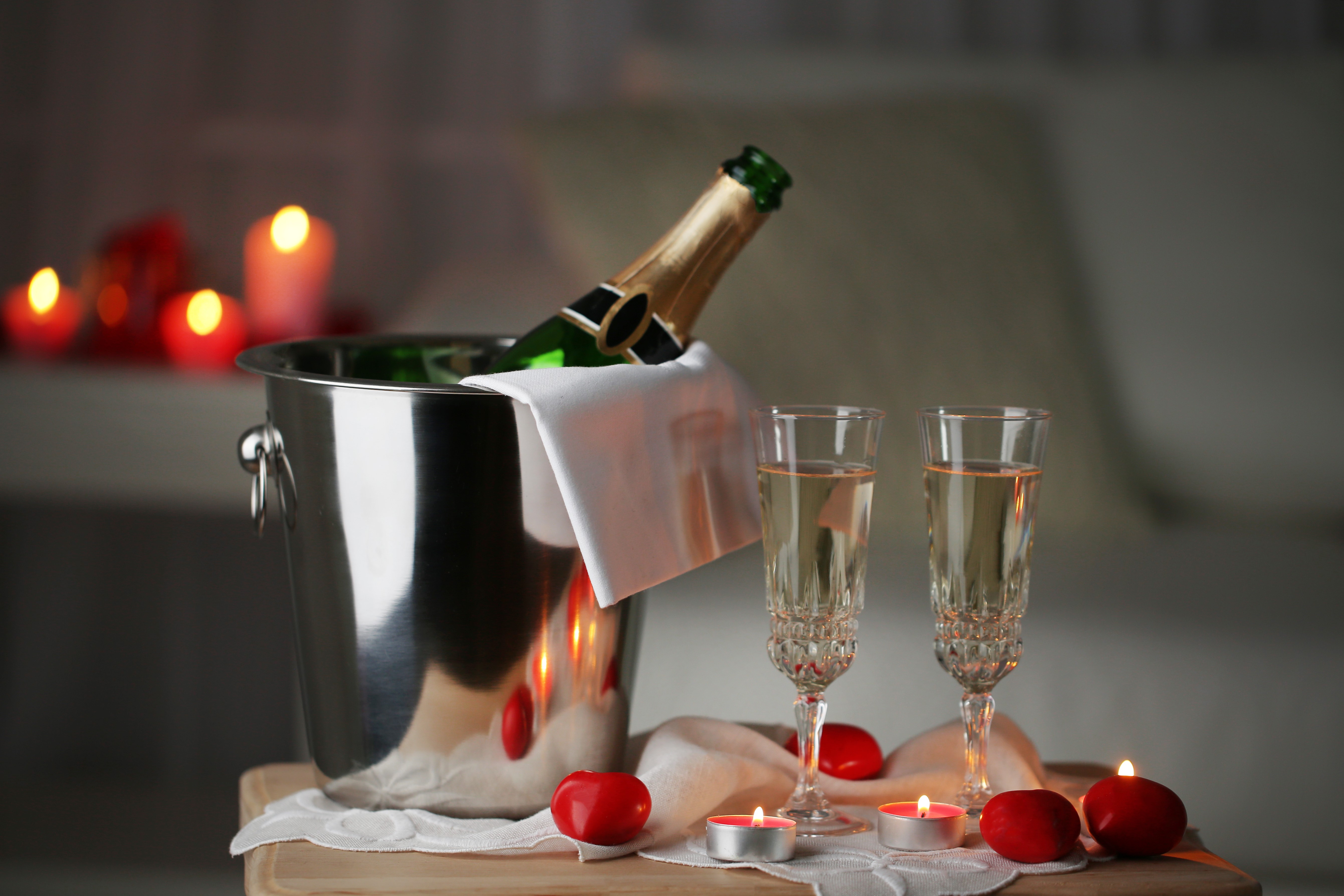 Champagne bottle and glasses with candles HD Wallpaper