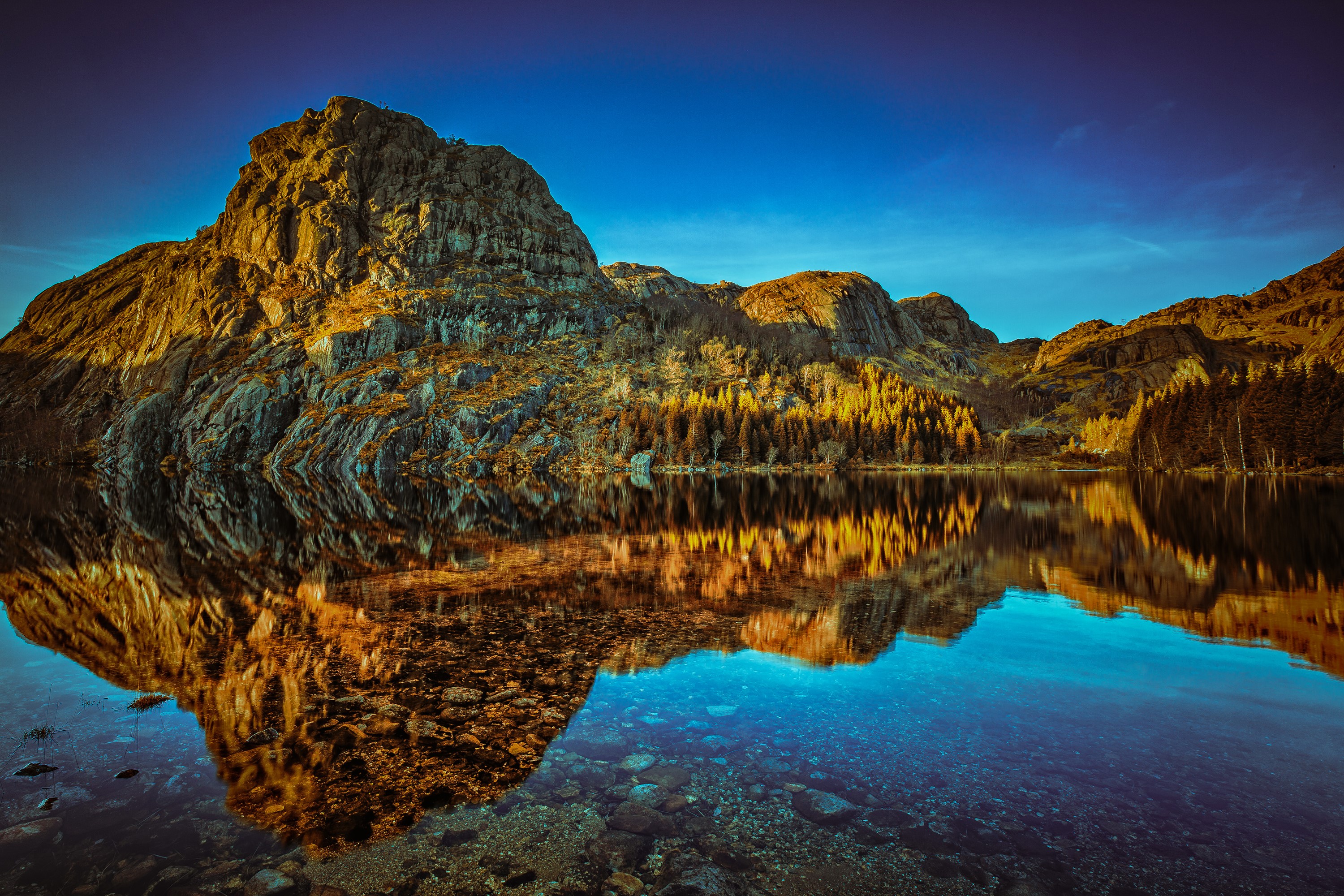 Mountain reflected in a lake in Rogaland, Norway HD Wallpaper