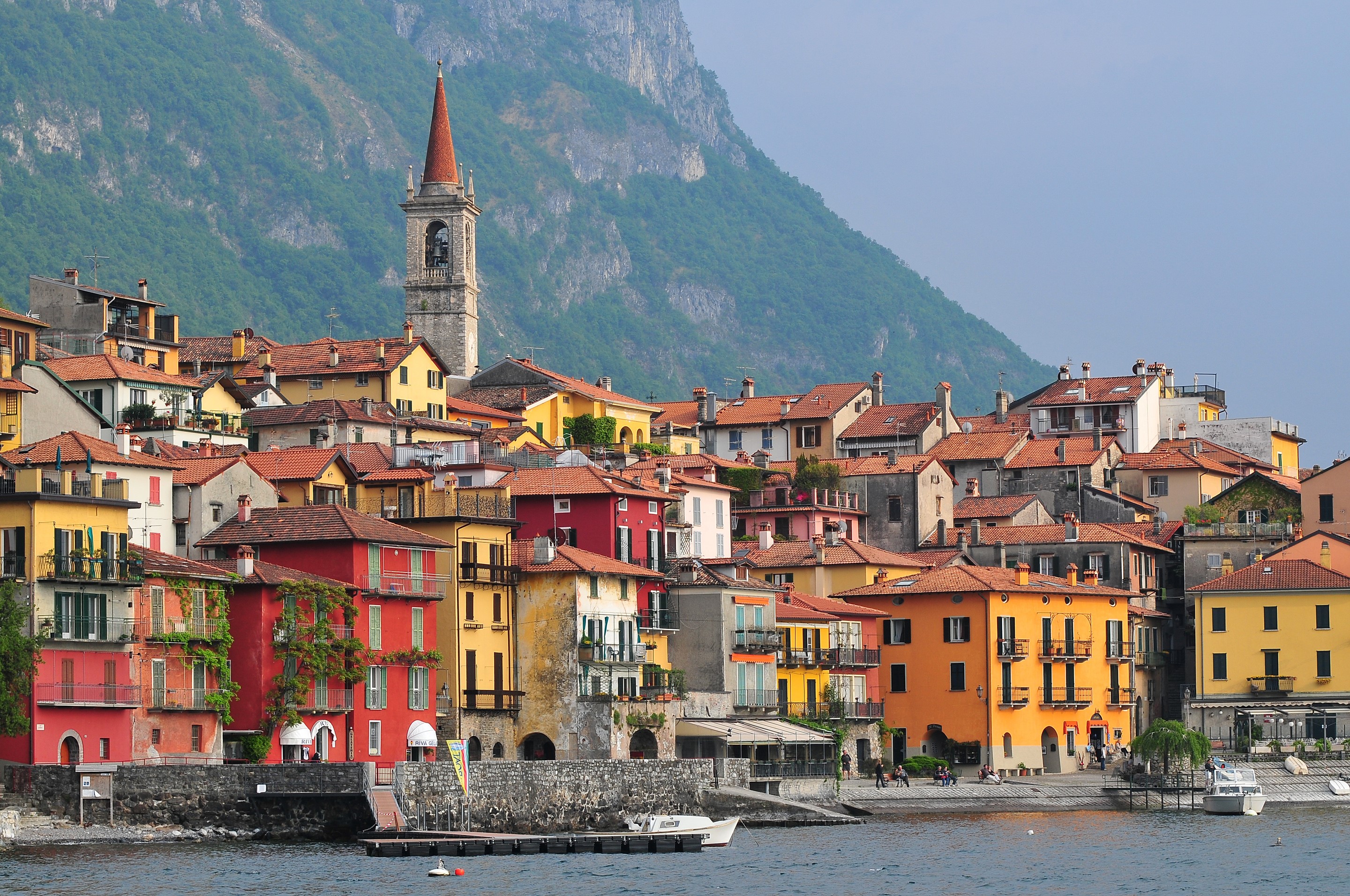 Colorful houses on a lake in Lombardy, Italy HD Wallpaper