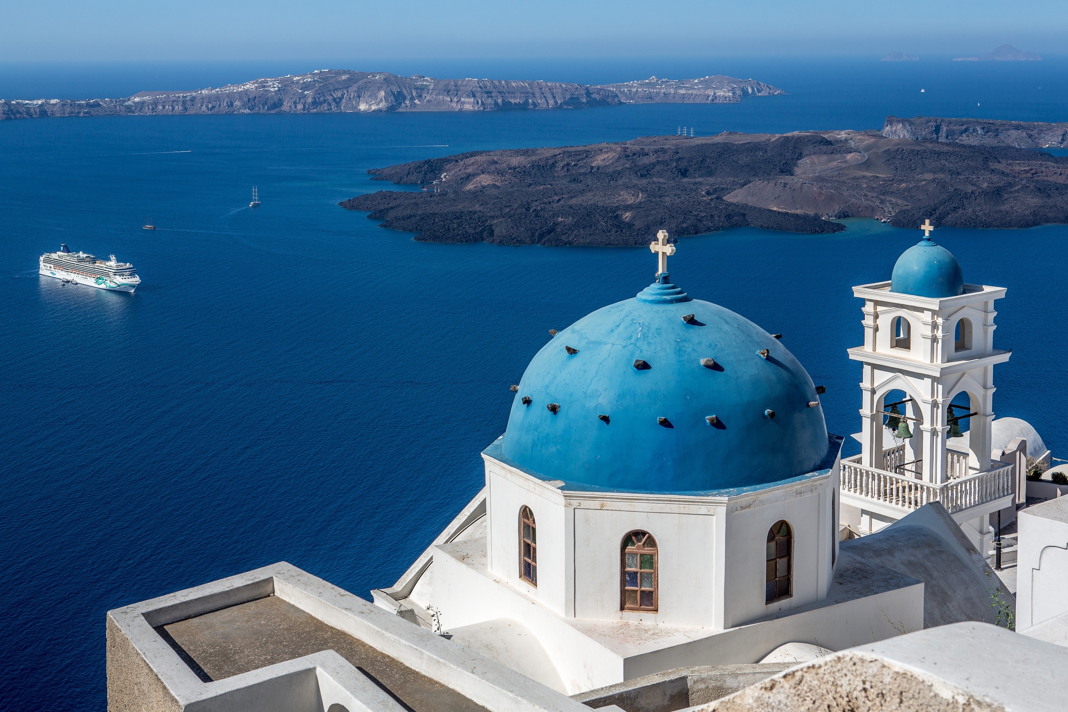 Blue domed church overlooking the Aegean Sea in Santorini, Greece HD Wallpaper